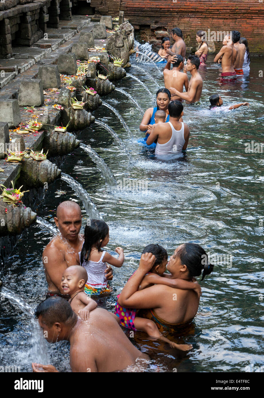 Bali, Indonesia.  Worshipers Bathing at Tirta Empul, a Spring Sacred to Balinese Hindus. Stock Photo