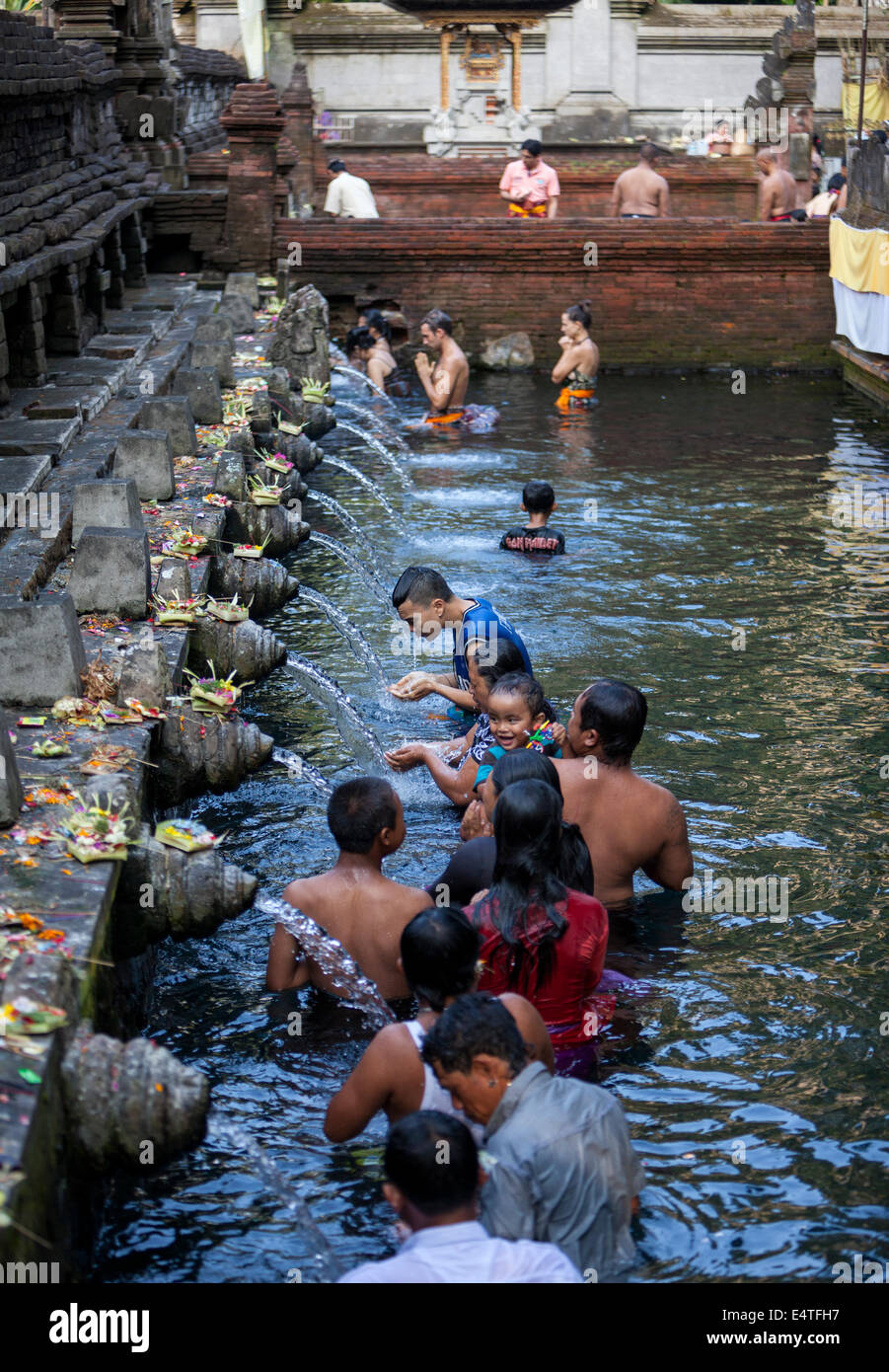 Bali, Indonesia.  Worshipers Bathing at Tirta Empul, a Spring Sacred to Balinese Hindus. Stock Photo