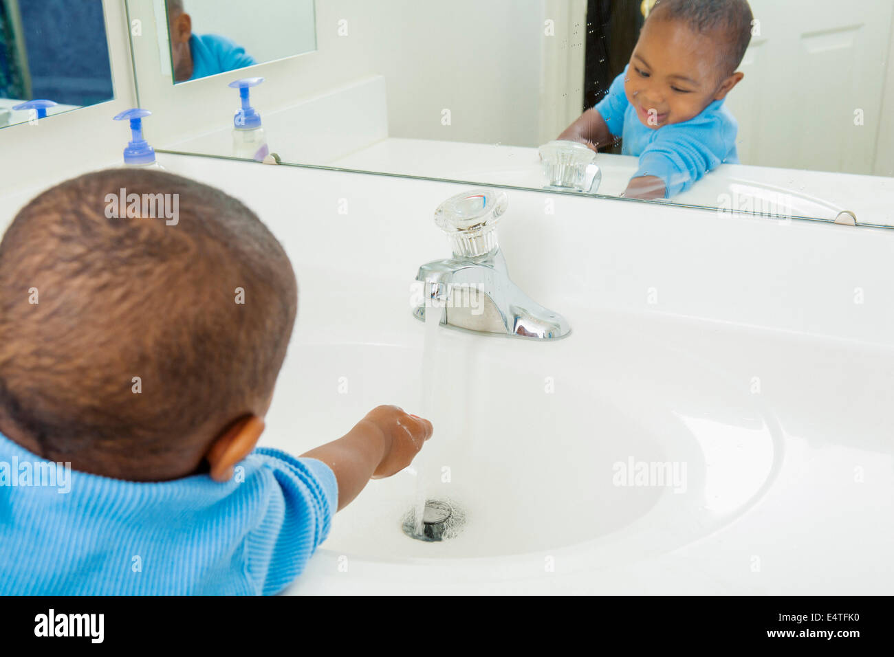 Toddler Washing his Hands in Bathroom Sink Stock Photo Alamy