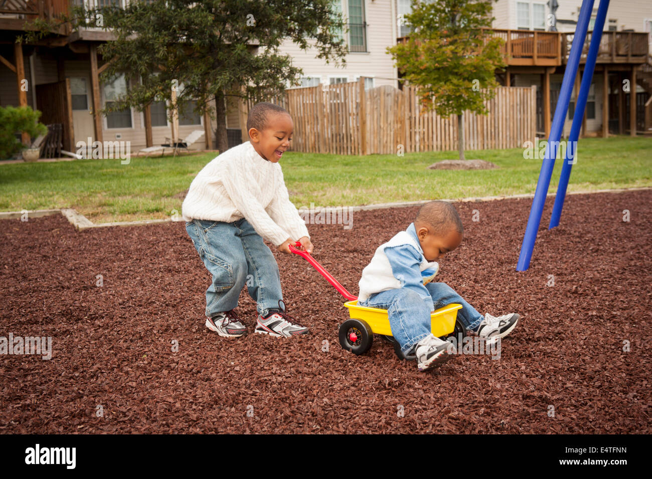 Boy pulling wagon hi-res stock photography and images - Alamy