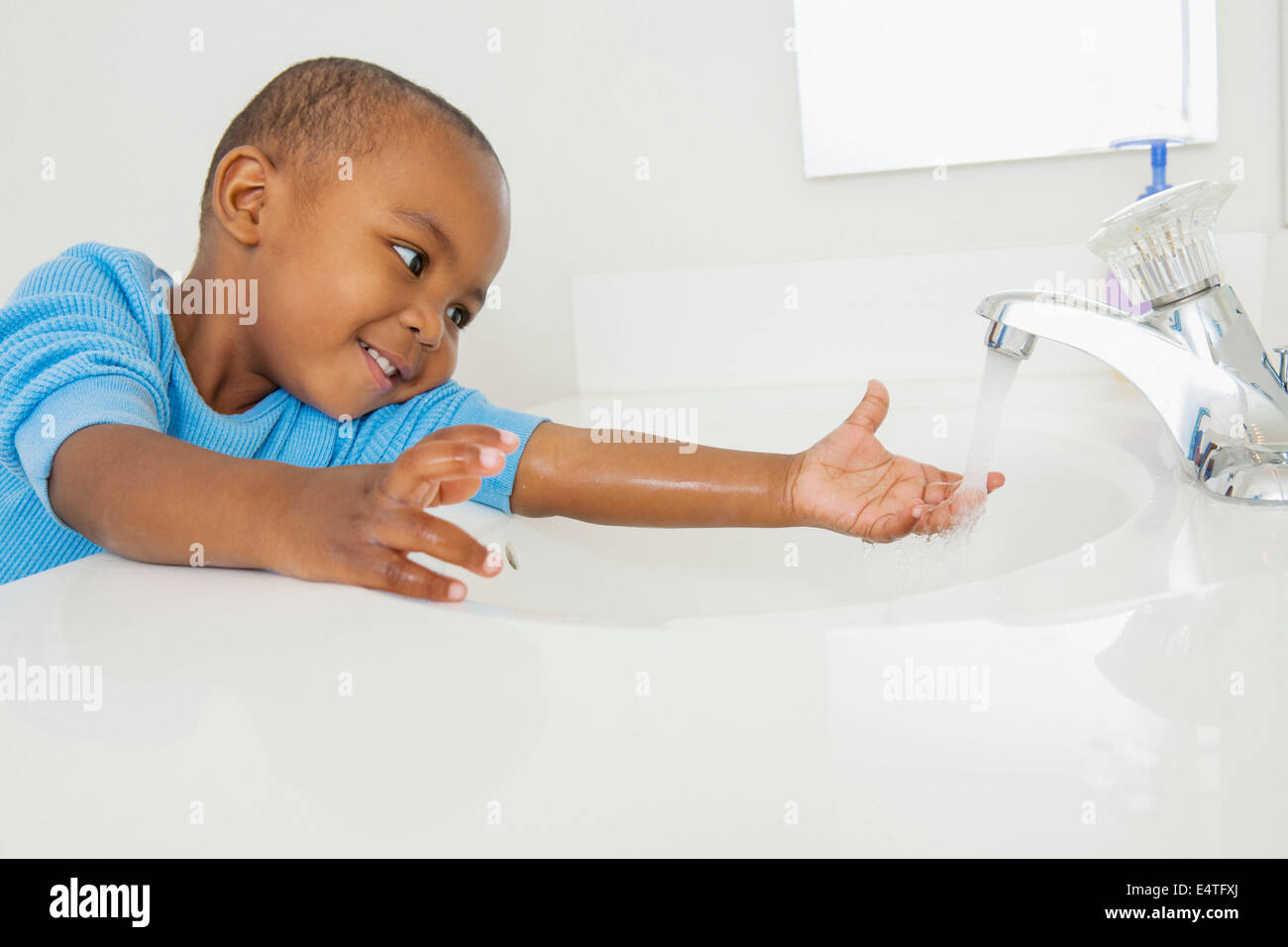 Toddler Washing his Hands in Bathroom Sink Stock Photo Alamy