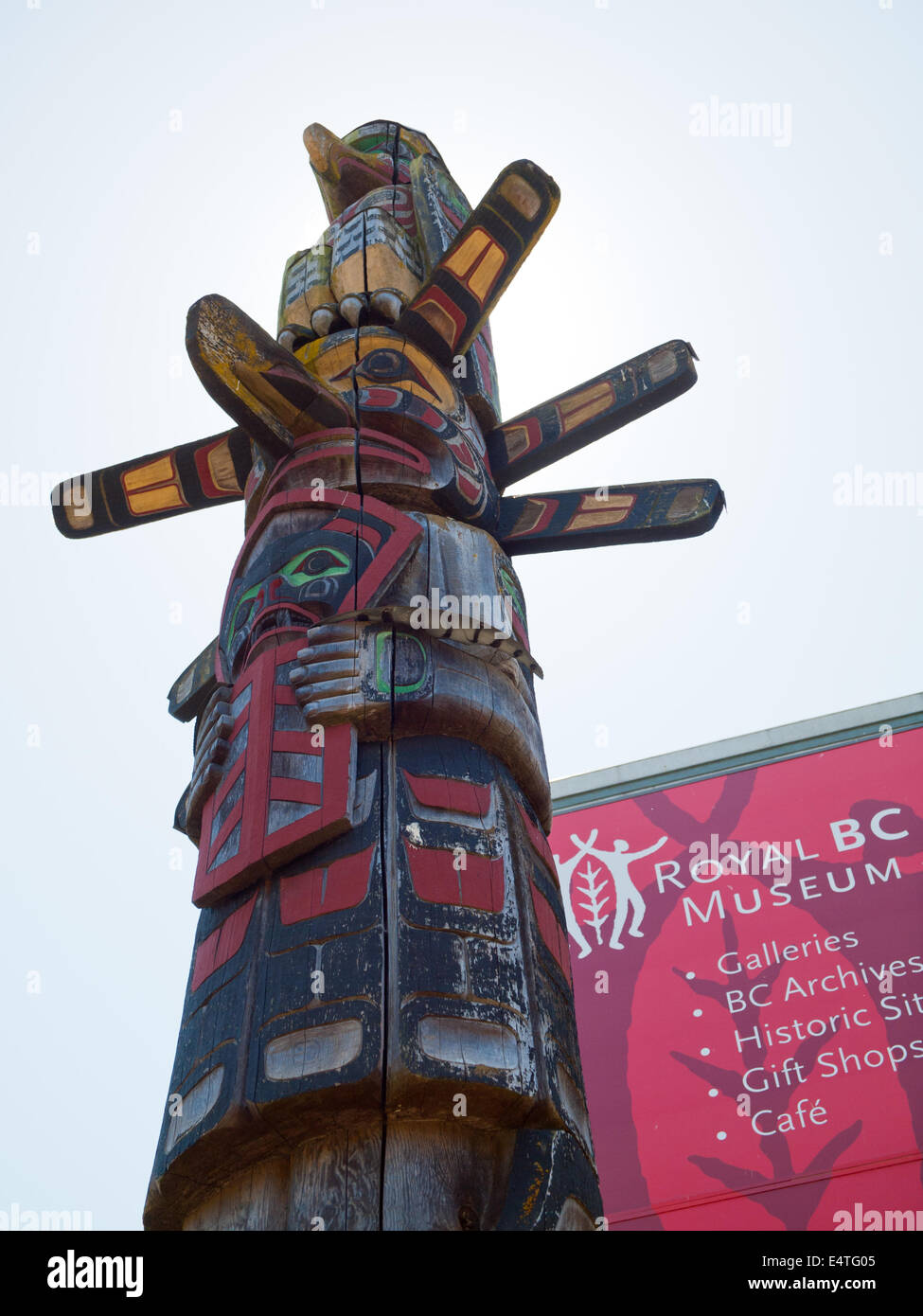A towering totem pole in front of the Royal BC Museum in Victoria, British Columbia, Canada. Stock Photo
