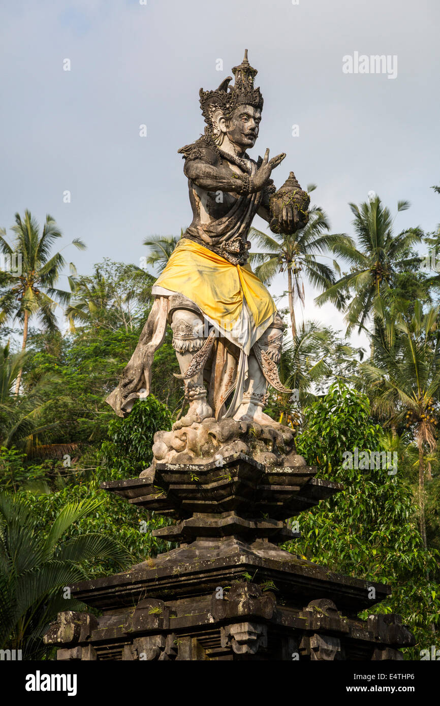 Bali, Indonesia.  Statue of Hindu God Indra Bringing Holy Water at Tirta Empul, a Spring Sacred to Balinese Hindus. Stock Photo