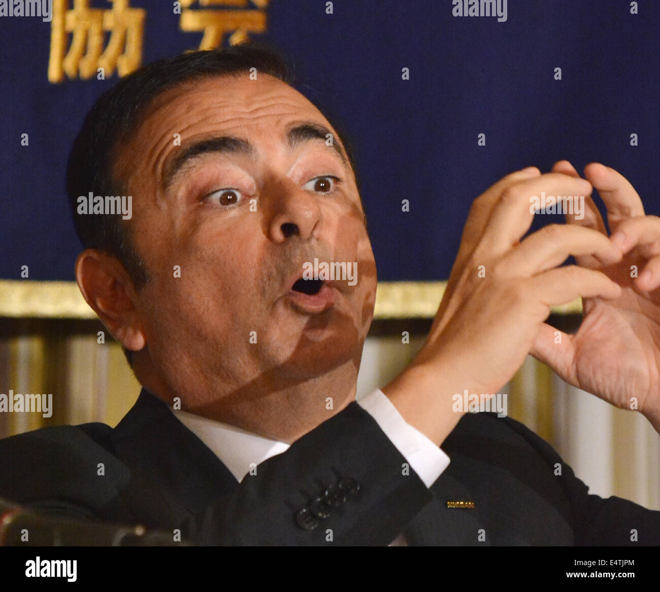 Tokyo, Japan. 17th July, 2014. Calos Ghosn, president and CEO of Nissan Motor Co., talks with over-gesticulation during a news conference at Tokyo's Foreign Correspondents' Club of Japan on Thursday, July 17, 2014. The Brazilian-born French, who has came to the rescue of the Japanese company from the brink of bankruptcy 13 years ago, earned more than $10 million in 2013, four times more than what President Akio Toyoda of Toyota Motor Corp., making him the most-paid executive in Japan, despite the fact that his Nissan is trailing far behind Toyota. © Natsuki Sakai/AFLO/Alamy Live News Stock Photo
