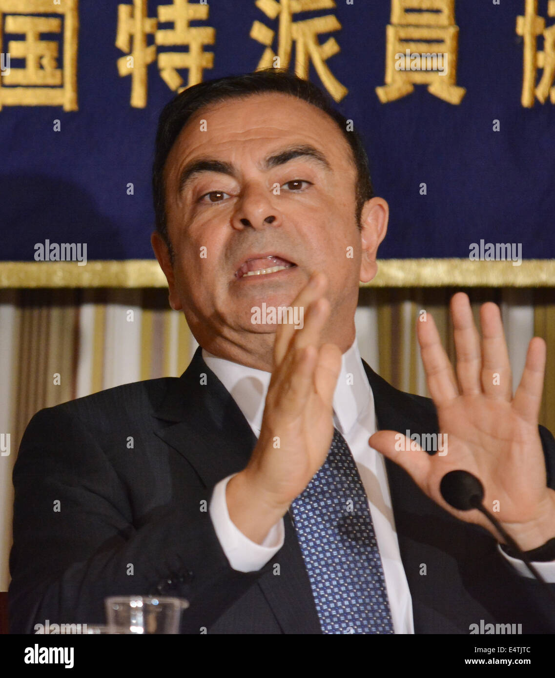 Tokyo, Japan. 17th July, 2014. Calos Ghosn, president and CEO of Nissan Motor Co., talks with over-gesticulation during a news conference at Tokyo's Foreign Correspondents' Club of Japan on Thursday, July 17, 2014. The Brazilian-born French, who has came to the rescue of the Japanese company from the brink of bankruptcy 13 years ago, earned more than $10 million in 2013, four times more than what President Akio Toyoda of Toyota Motor Corp., making him the most-paid executive in Japan, despite the fact that his Nissan is trailing far behind Toyota. © Natsuki Sakai/AFLO/Alamy Live News Stock Photo