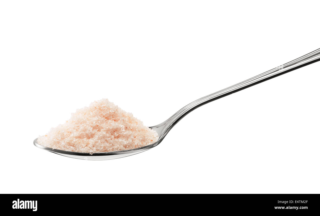 natural himalayan pink rock salt on teaspoon isolated on white Stock Photo