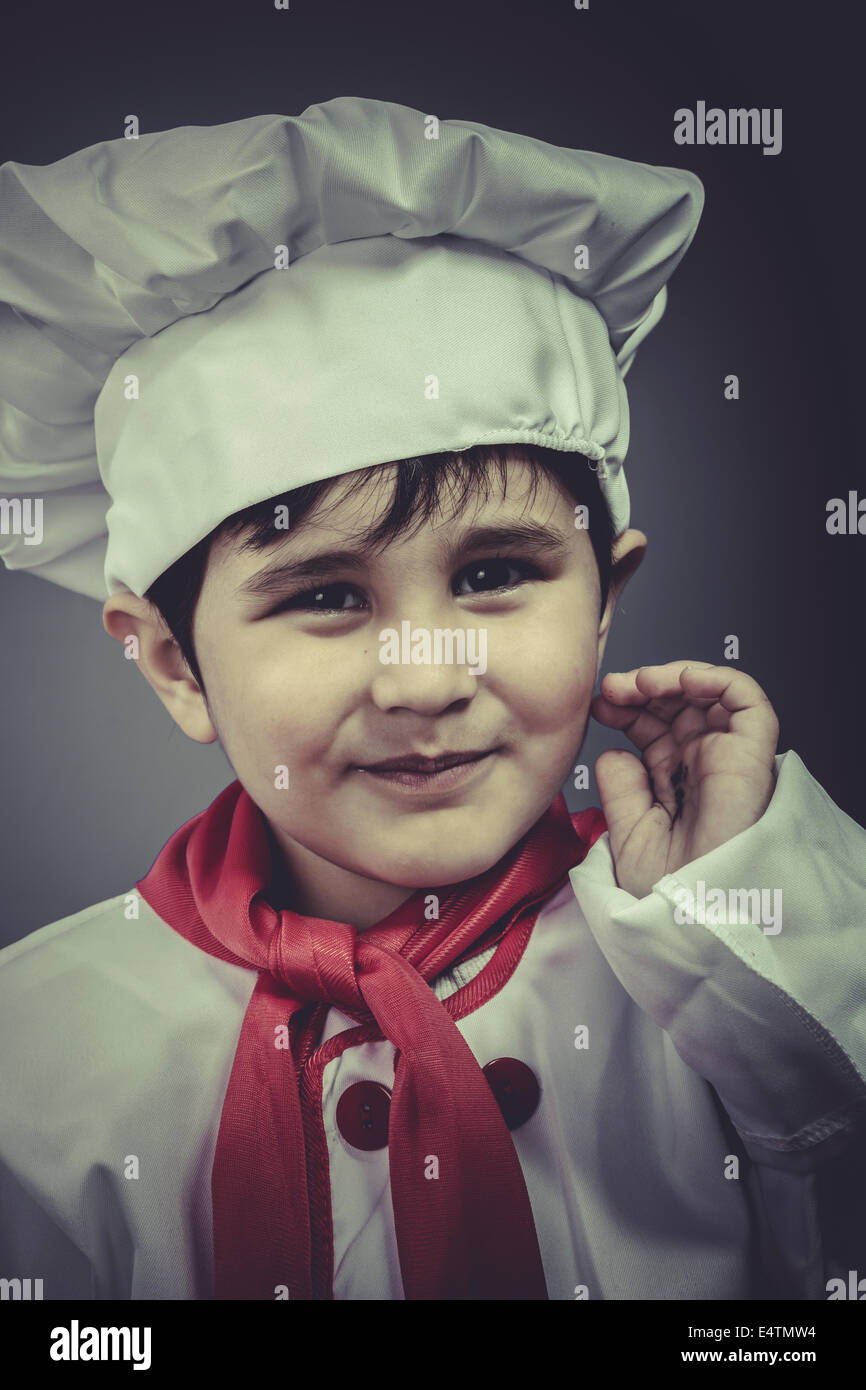 dinner, child dress funny chef, cooking utensils Stock Photo Alamy