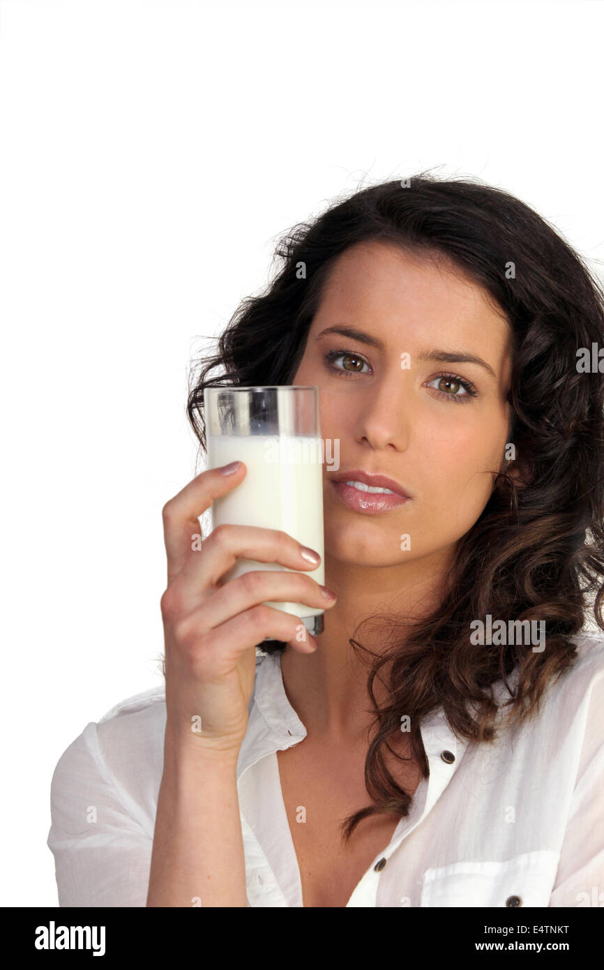 Woman drinking a glass of milk Stock Photo