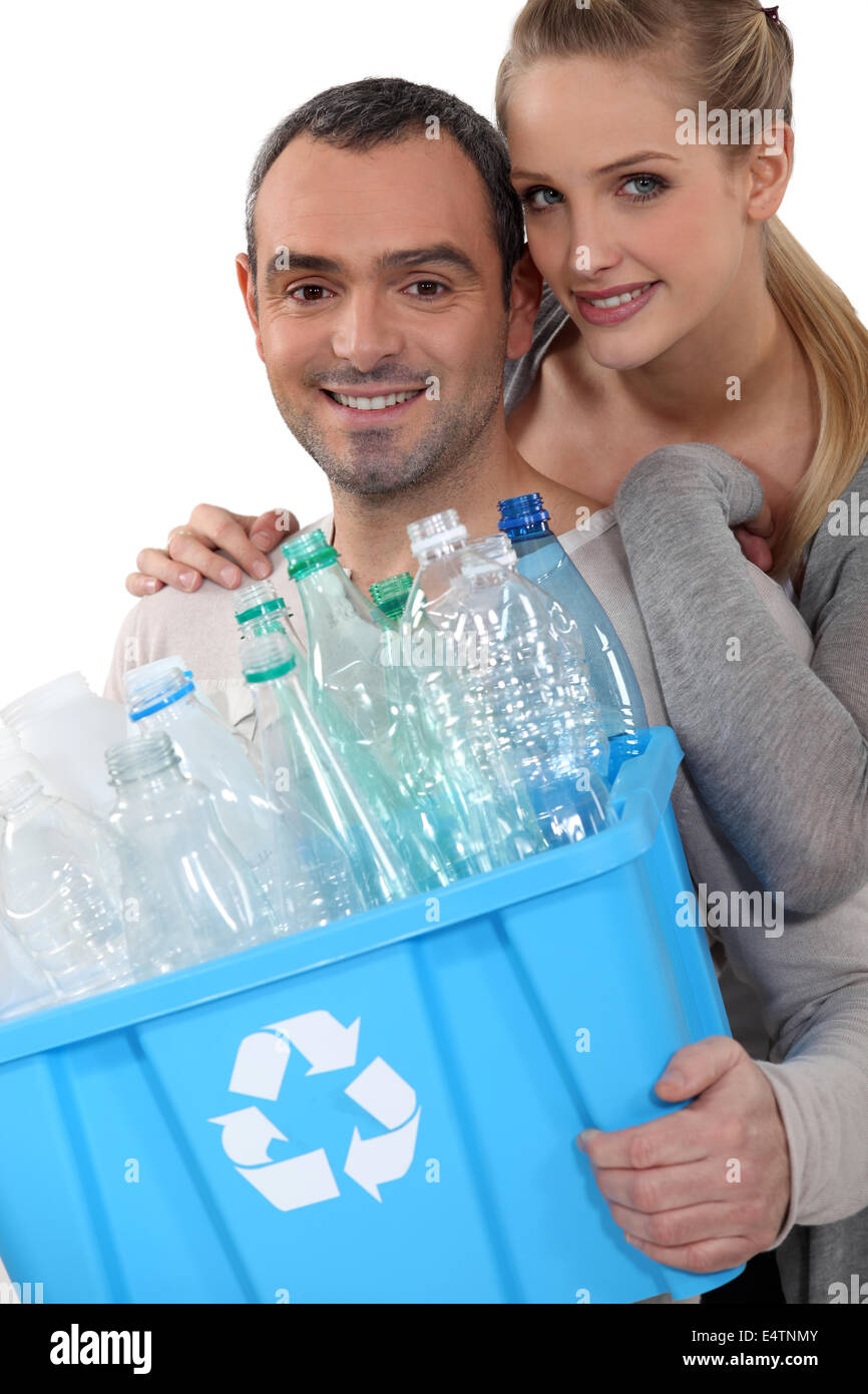 Couple taking out the recycling Stock Photo