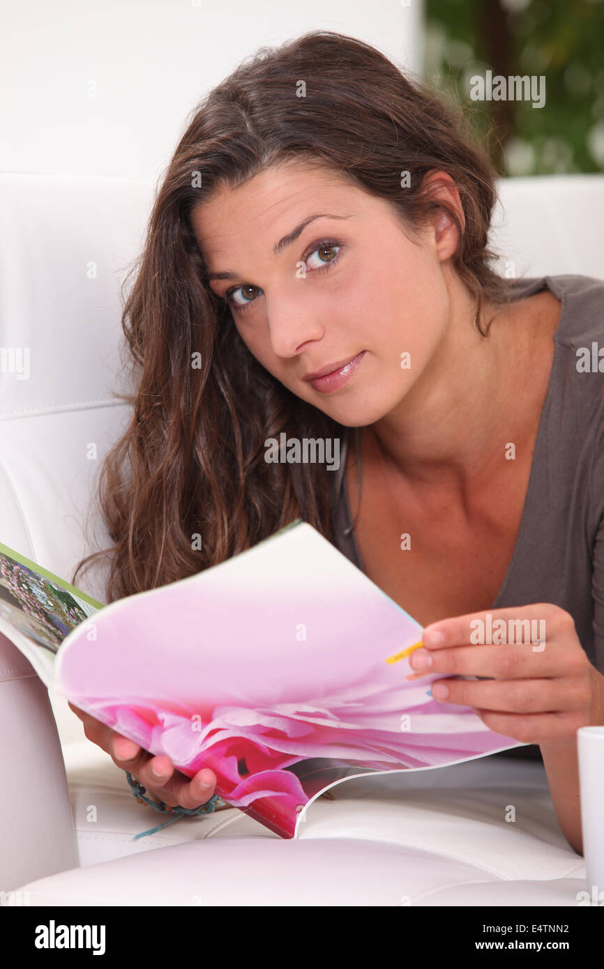 brown-haired woman looking at photos Stock Photo