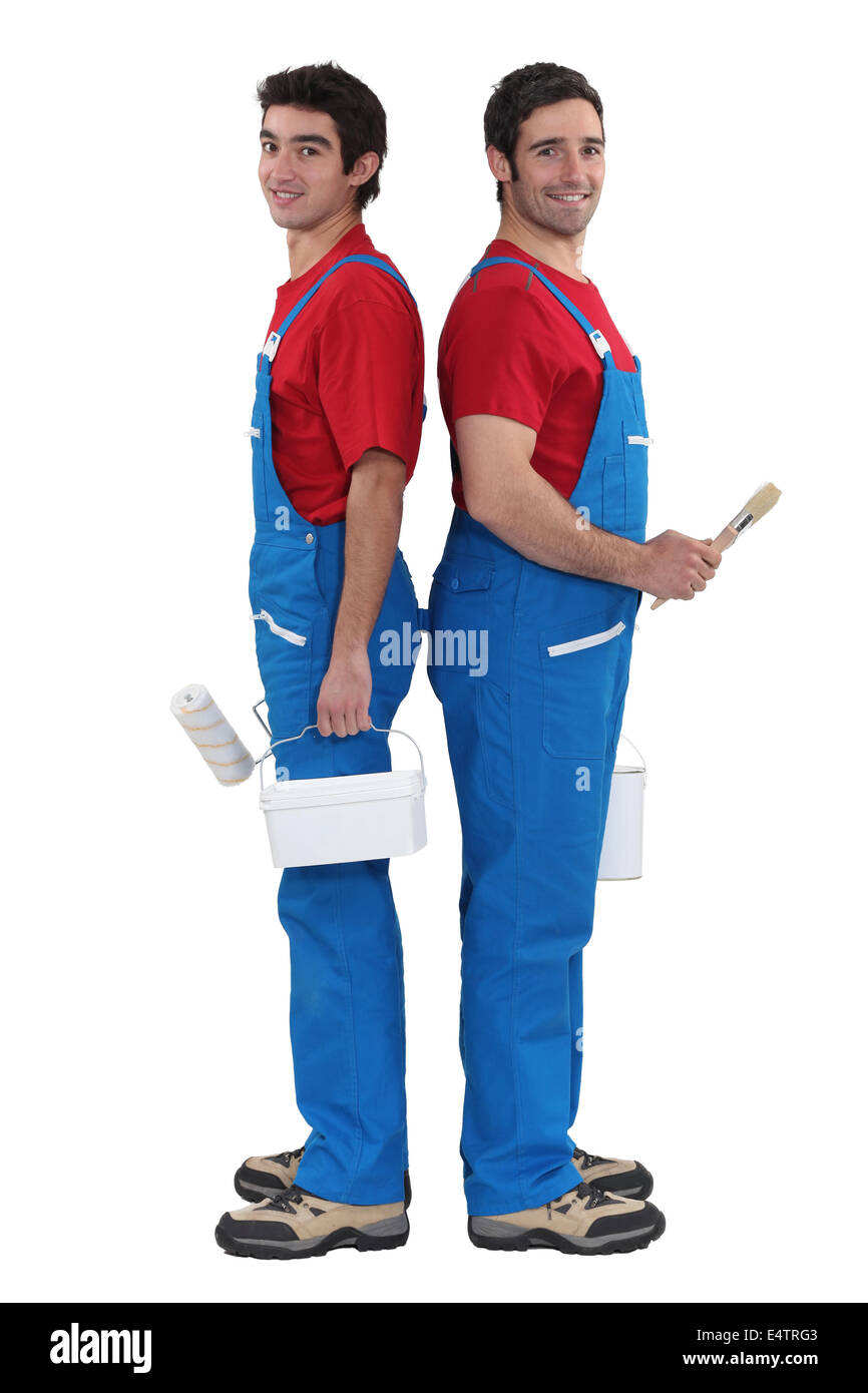 A team of painters standing back-to-back Stock Photo