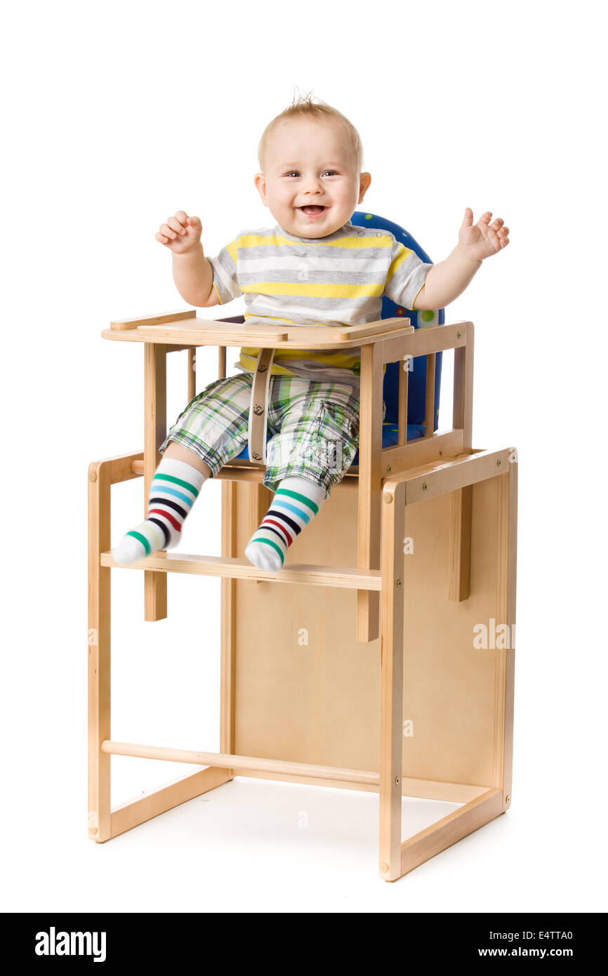 Baby sitting in highchair Stock Photo Alamy