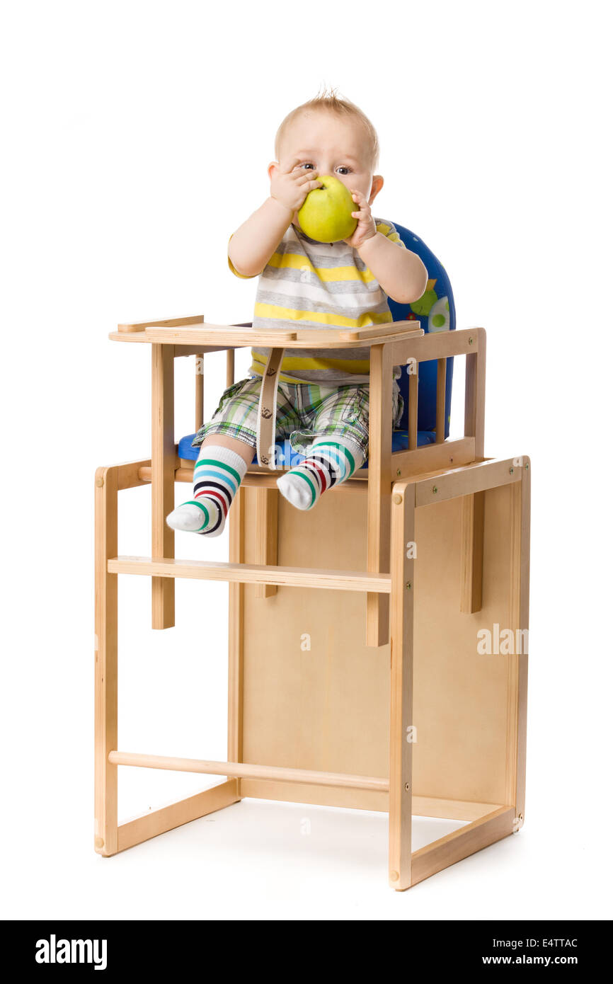 Baby sitting in highchair Stock Photo Alamy