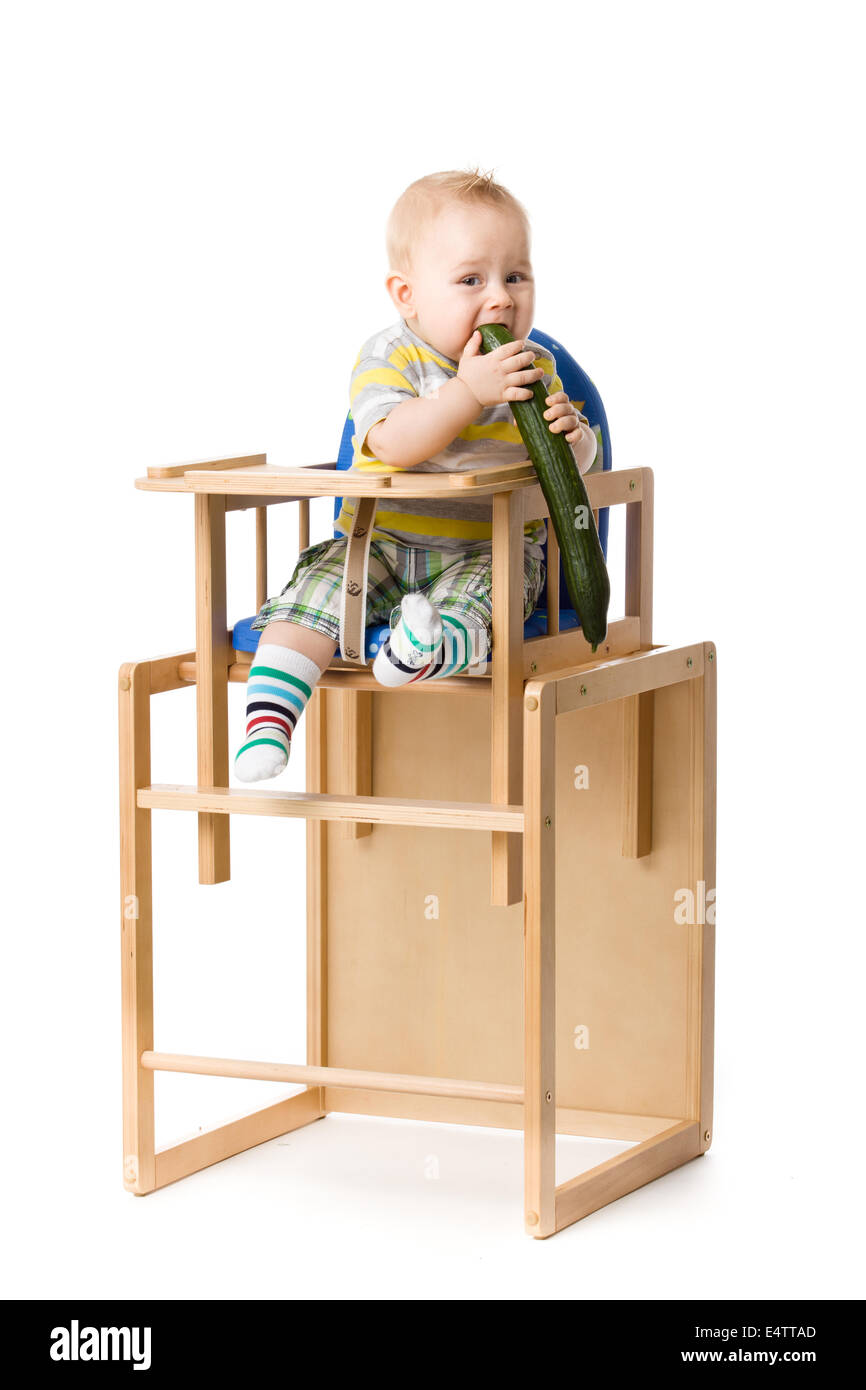 Baby sitting in highchair Stock Photo Alamy