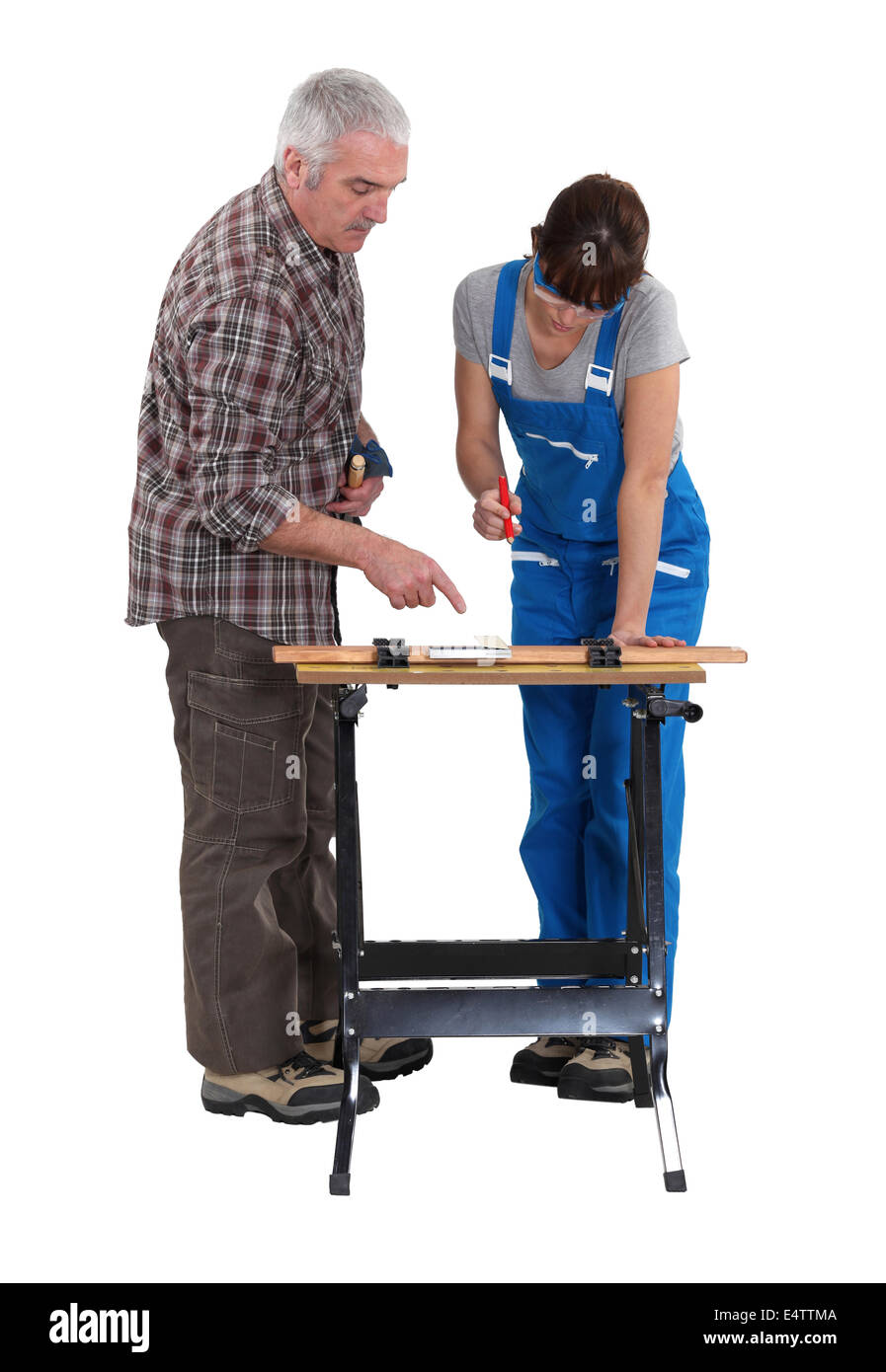 Carpenter with young intern Stock Photo