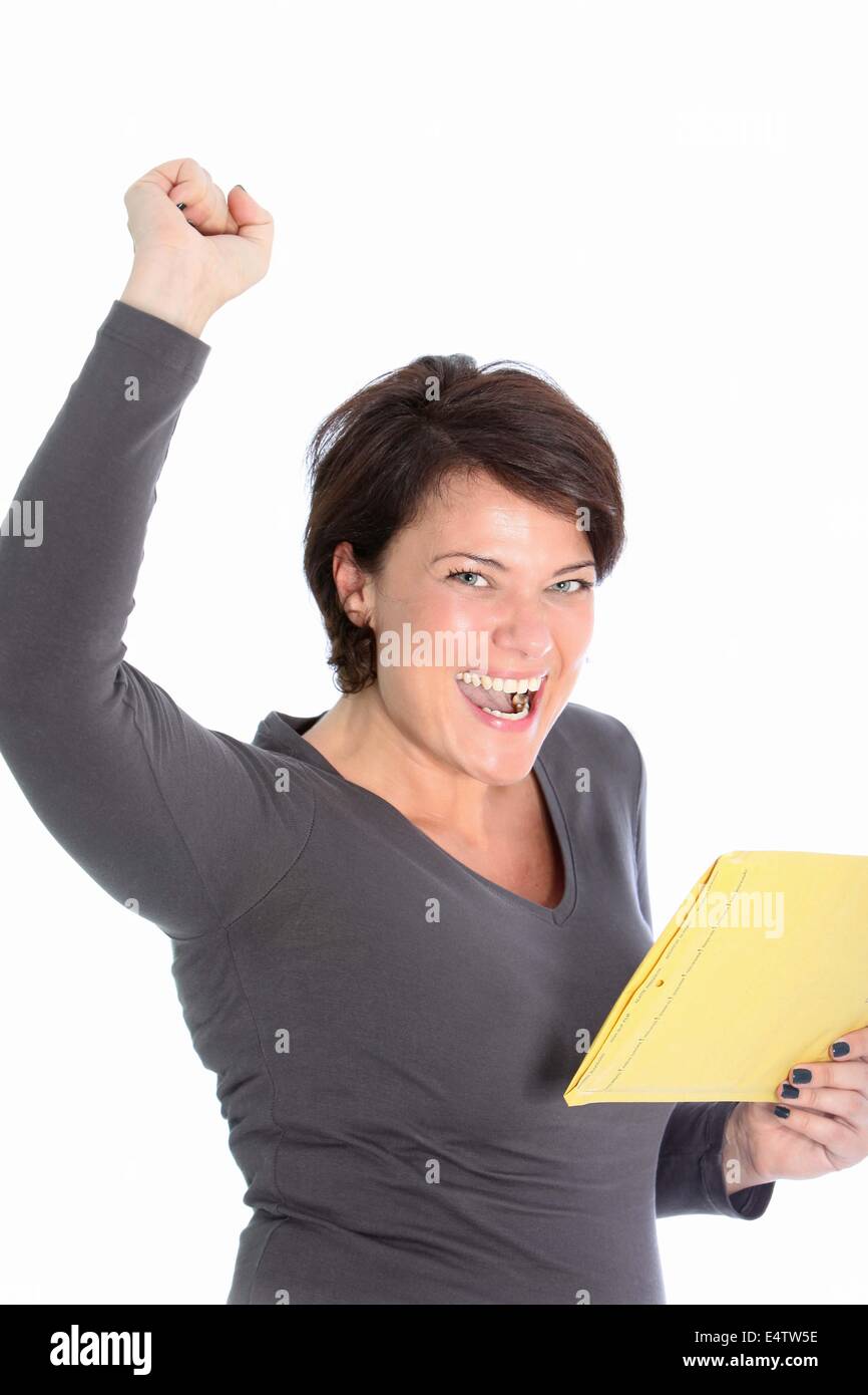 Jubilant woman rejoicing news in a letter Stock Photo