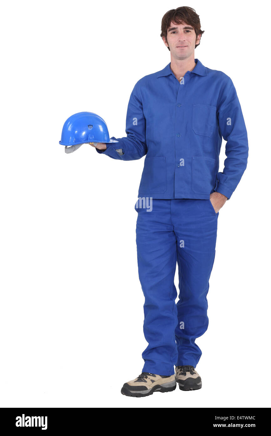 A construction worker dressed all in blue. Stock Photo