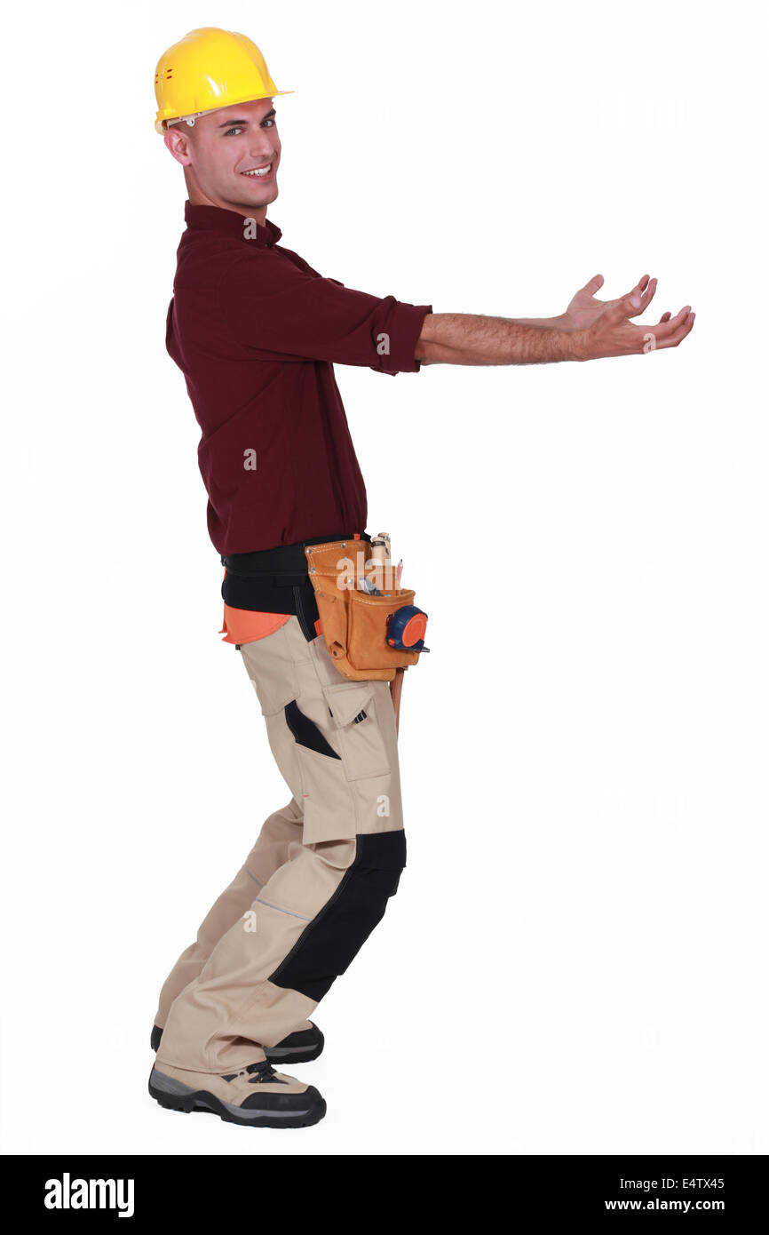 Tradesman carrying an invisible object Stock Photo