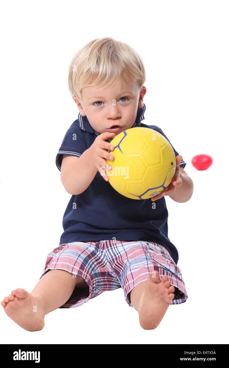 Little boy holding football Stock Photo Alamy
