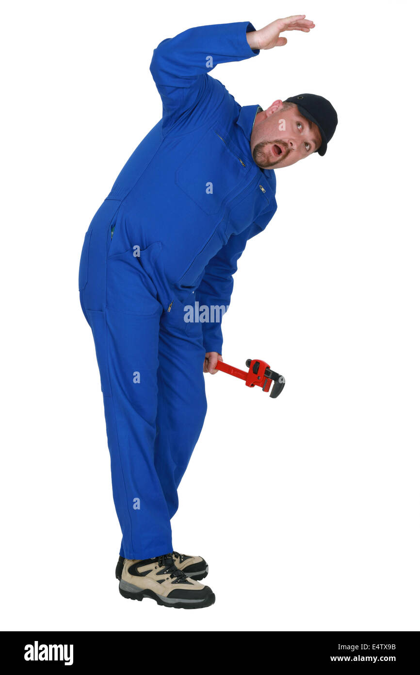 Plumber having an accident Stock Photo