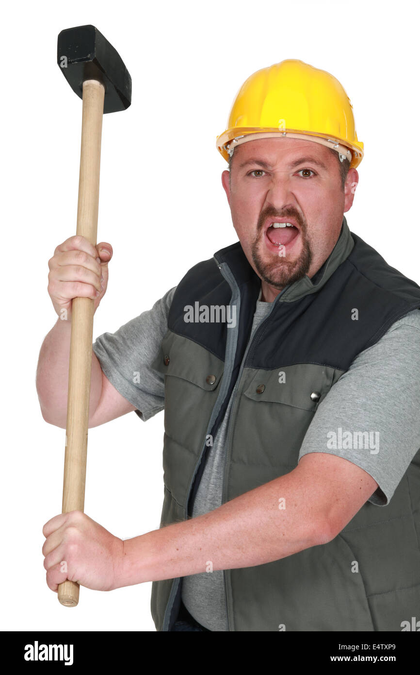 An angry tradesman holding a mallet Stock Photo