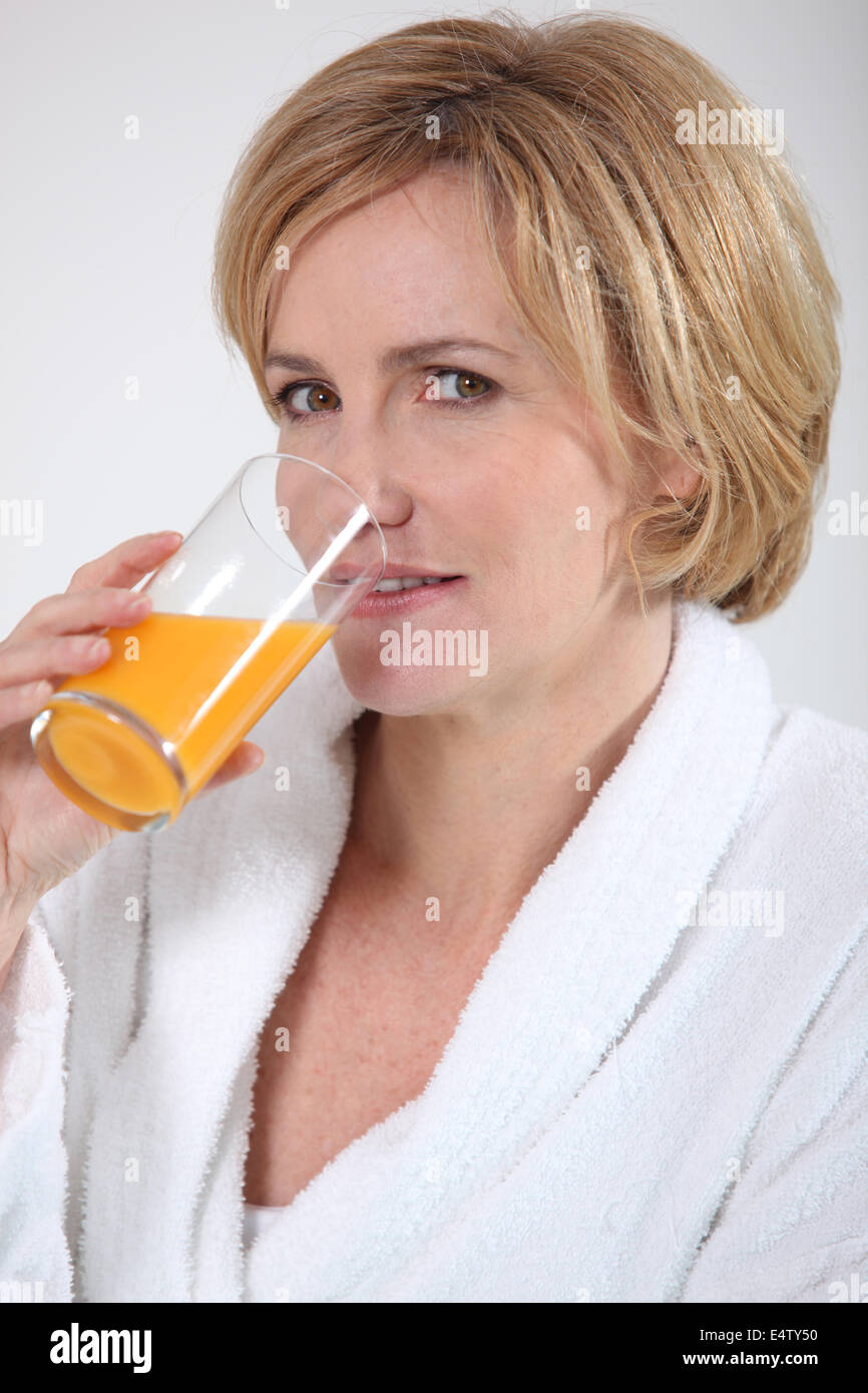woman-drinking-orange-juice-stock-photo-alamy