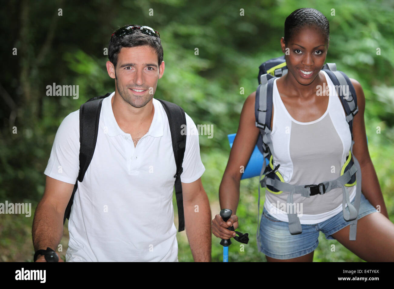 Two hikers in the woods Stock Photo - Alamy