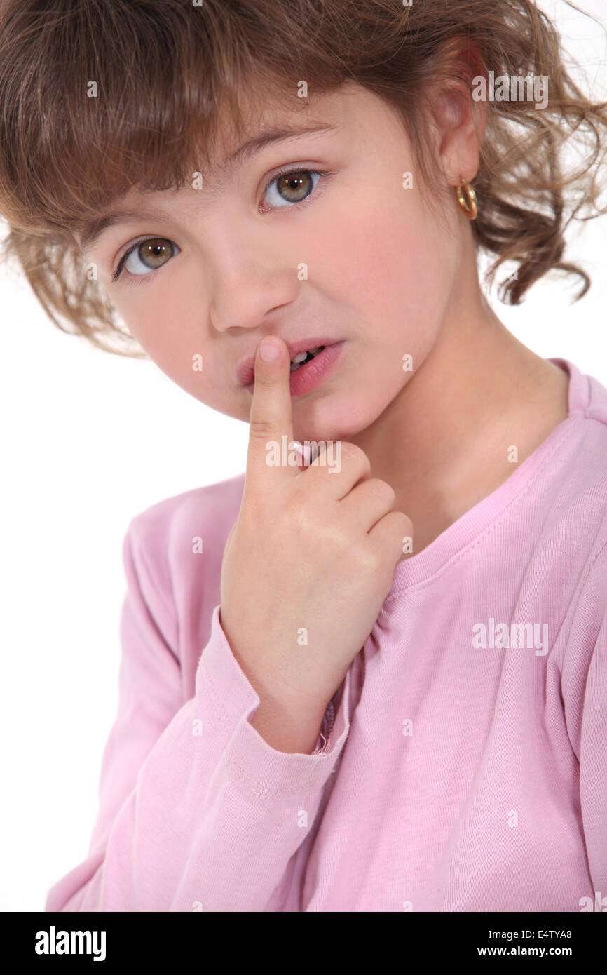 little girl touching her lips Stock Photo Alamy