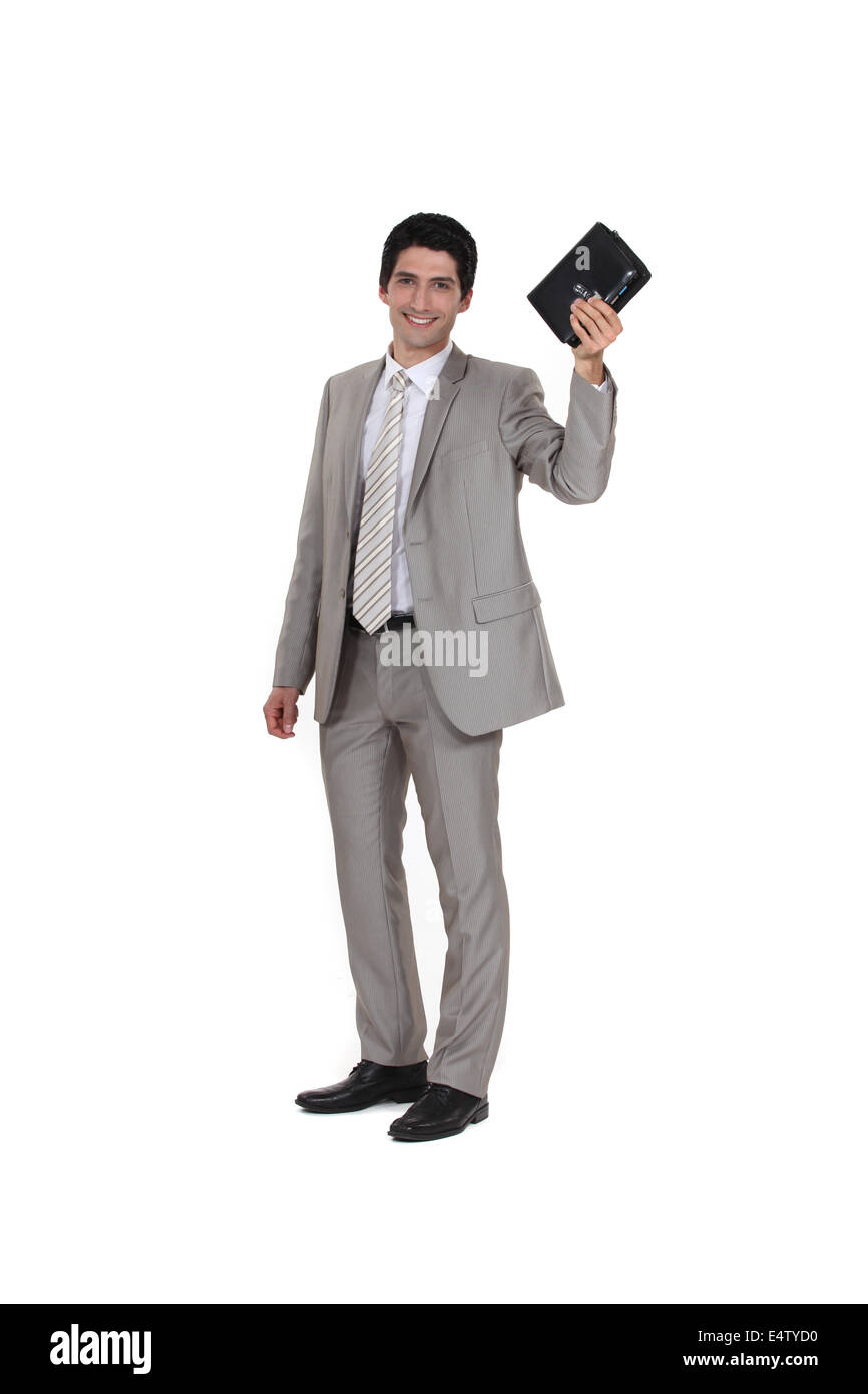 Businessman holding his leather-bound agenda Stock Photo
