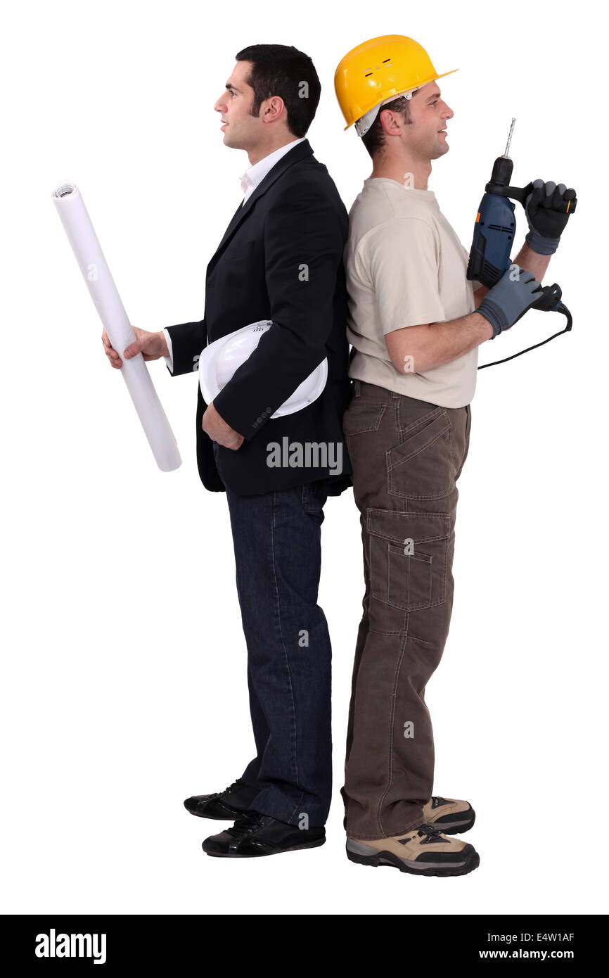 Tradesman and engineer standing back to back Stock Photo