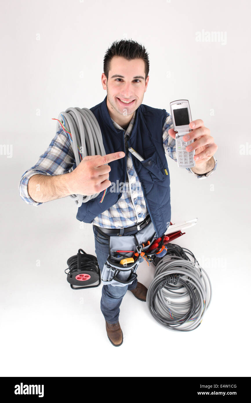 Tradesman with his mobile phone Stock Photo