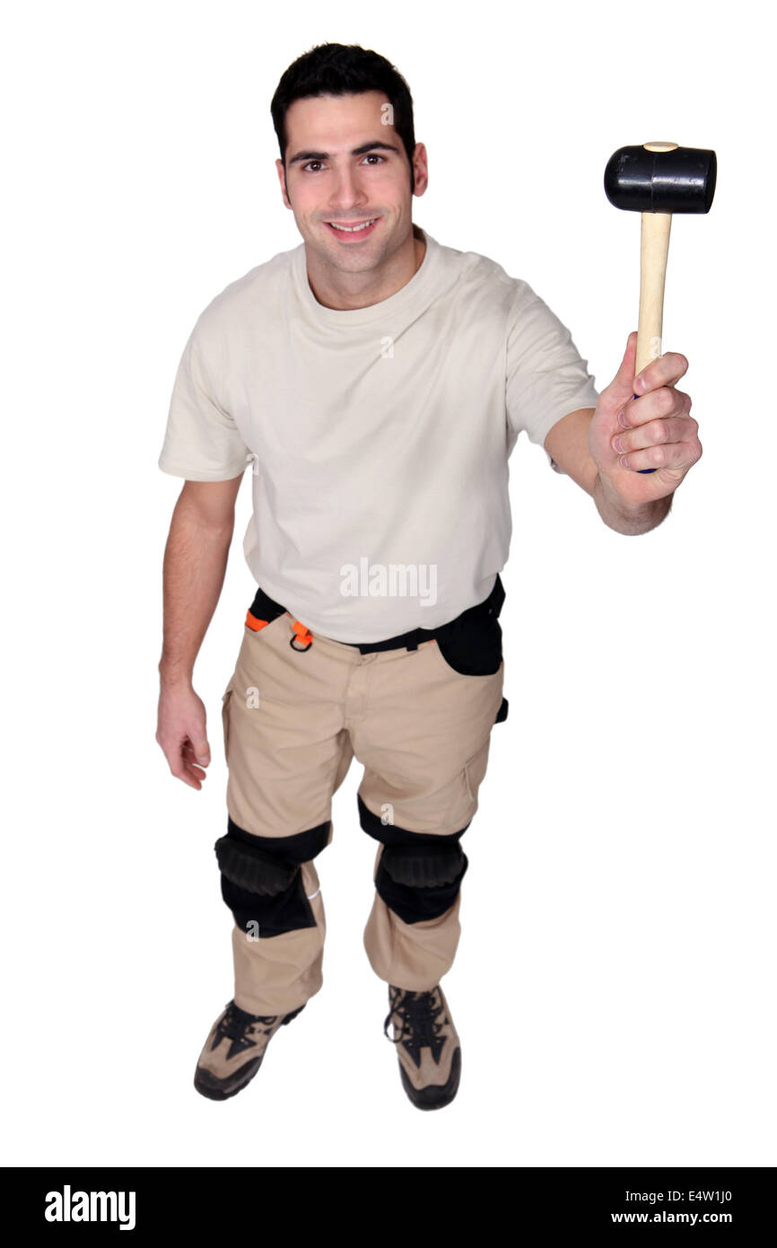 Man holding rubber mallet Stock Photo Alamy
