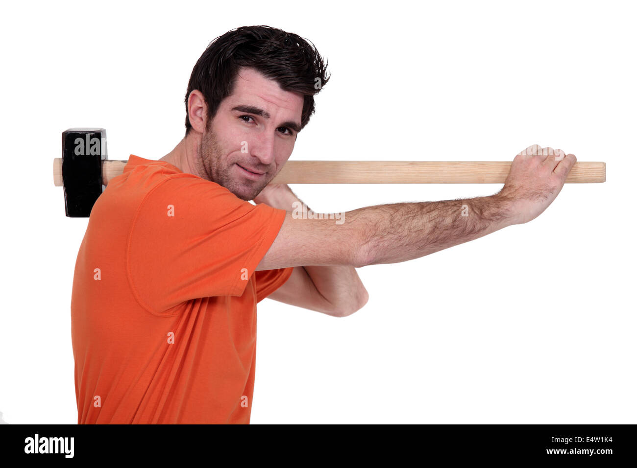 Man holding hammer on his shoulder hires stock photography and images