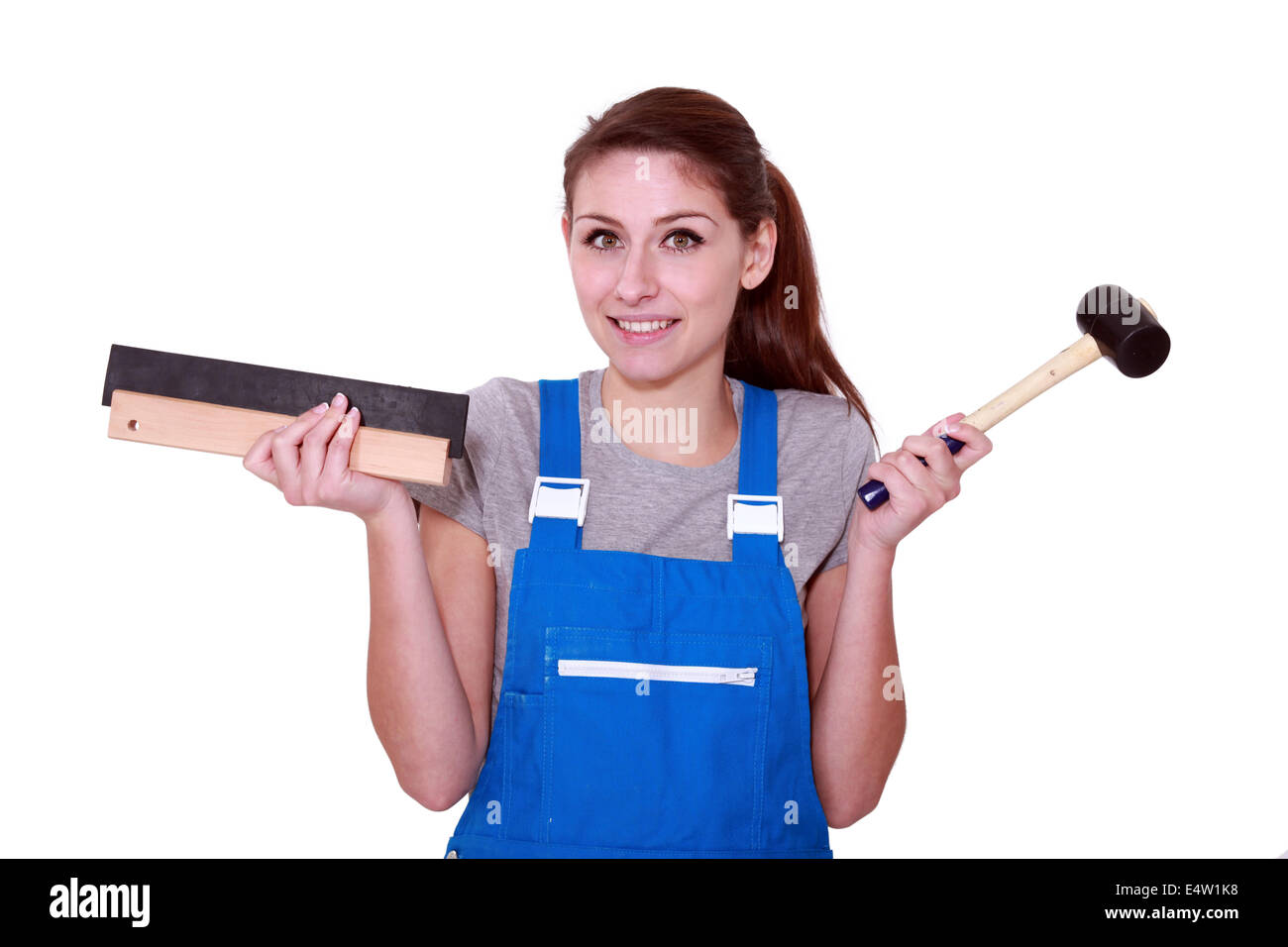 female worker holding hammer Stock Photo