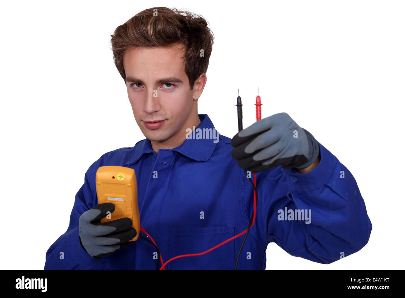 an electrician using an ammeter Stock Photo