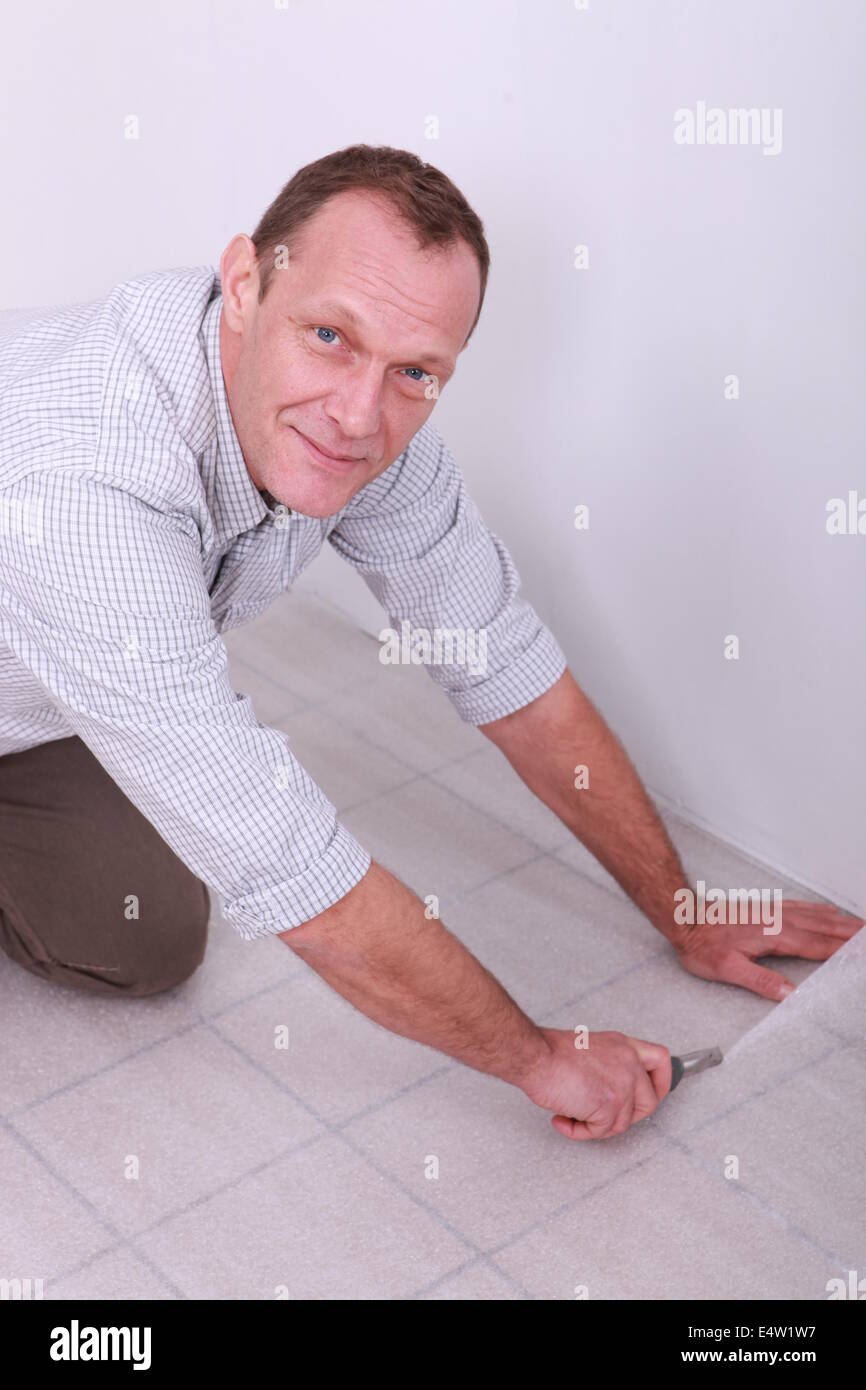 craftsman covering tiled floor Stock Photo