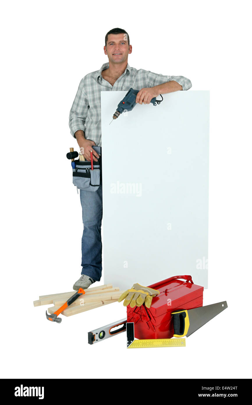 Handyman with tools and message board Stock Photo