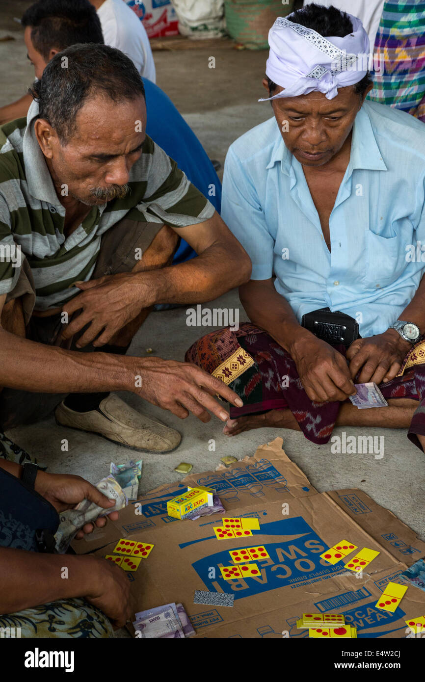 Bali, Indonesia. Gambling with Dominoes.  Dlod Blungbang Village. Stock Photo