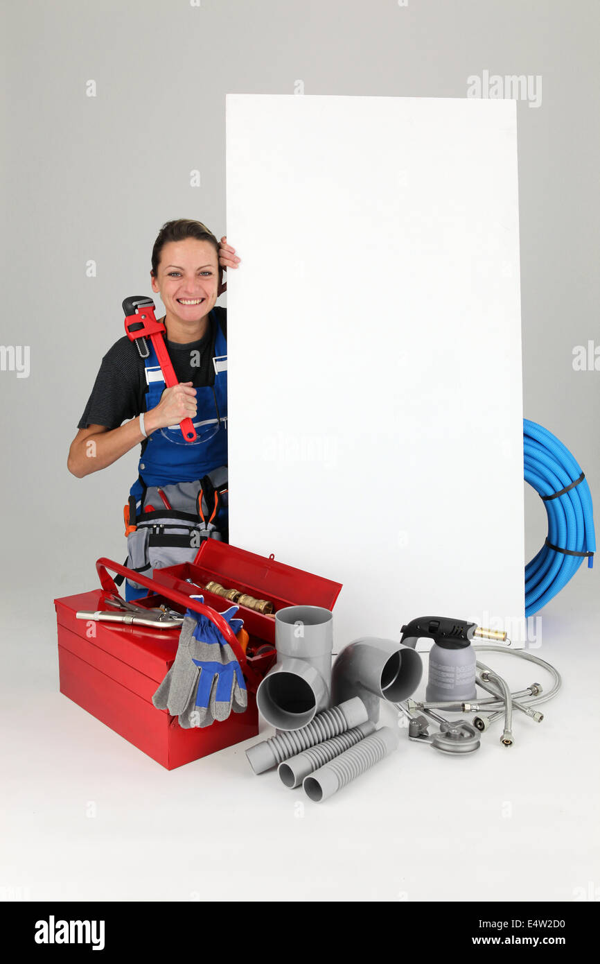 Woman with blank board and toolbox Stock Photo