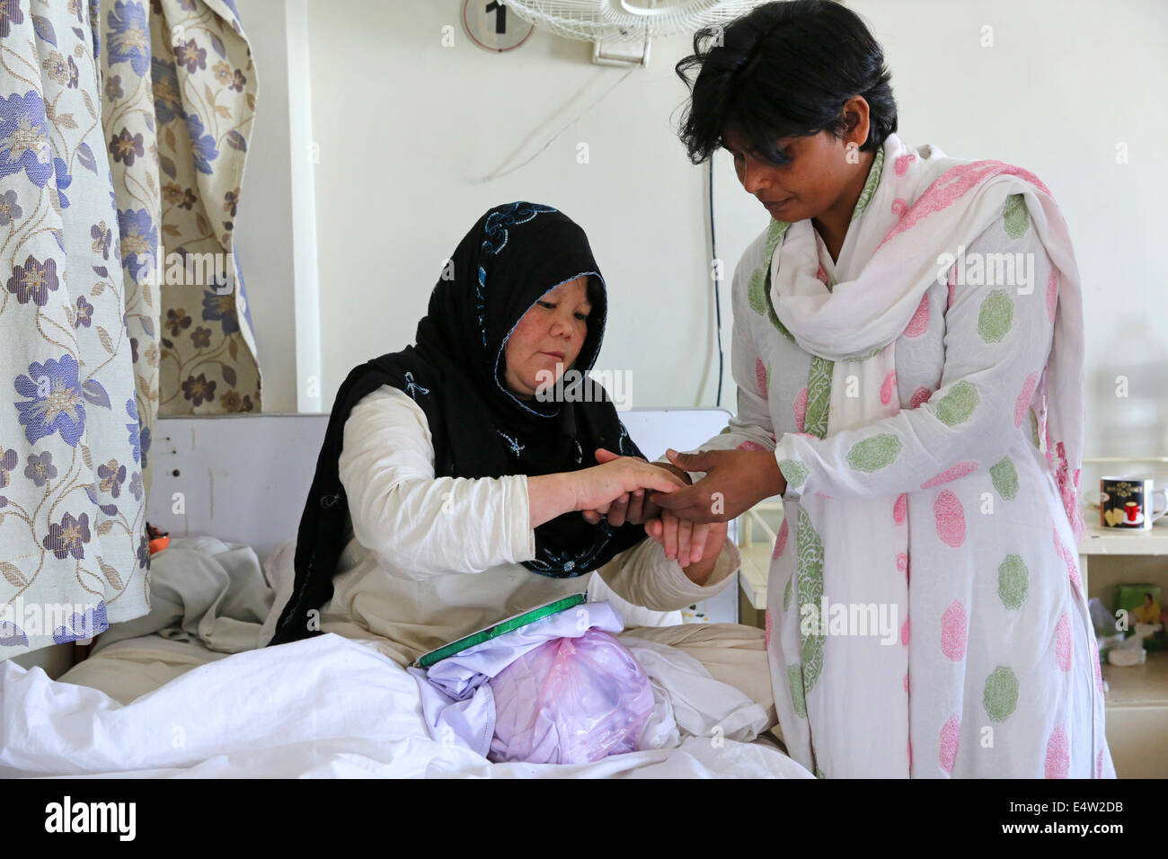 Leprosy patients and nurse in the Marie Adelaide Leprosy Centre, Karachi, Pakistan Stock Photo