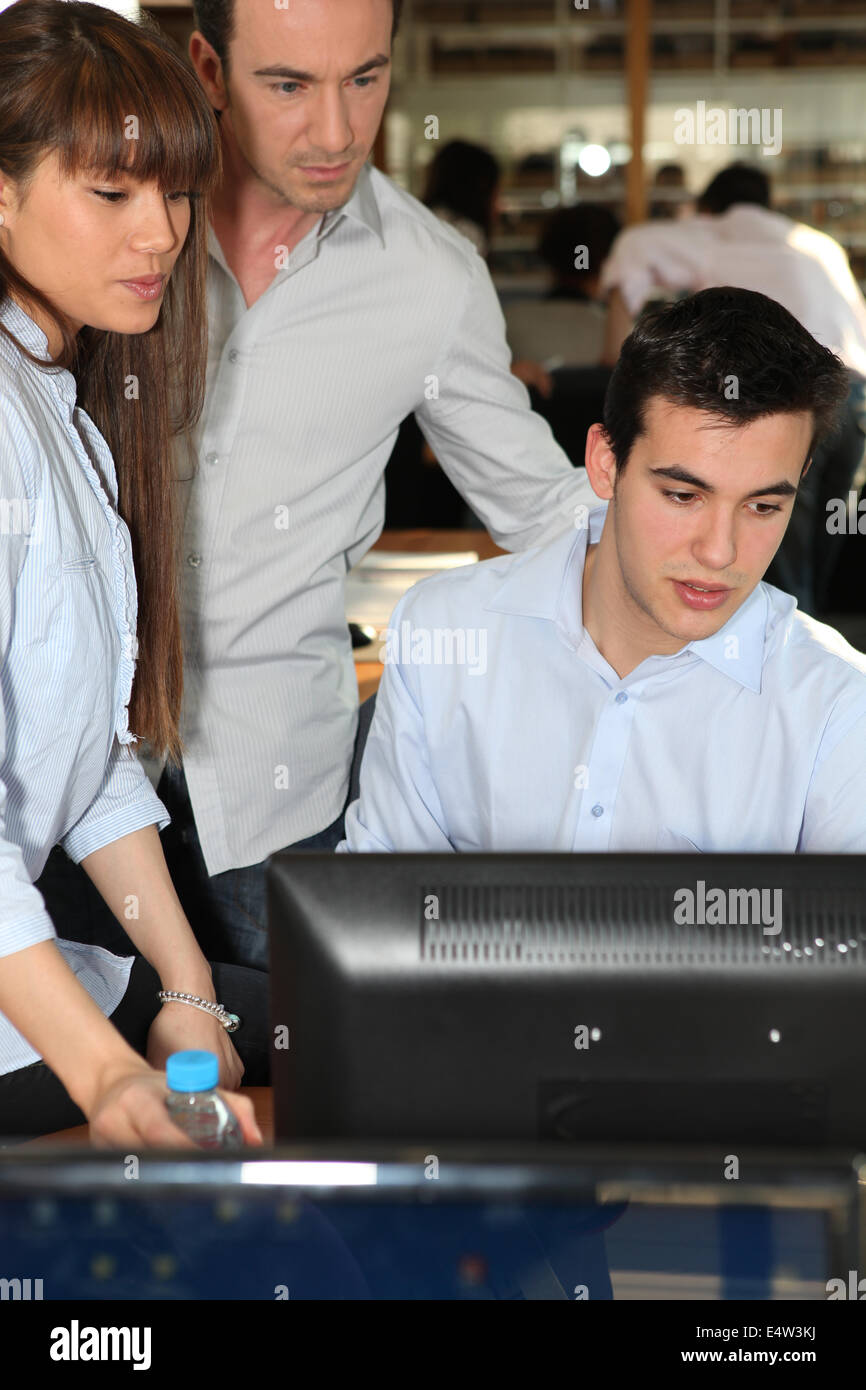Man showing project to colleagues at work Stock Photo