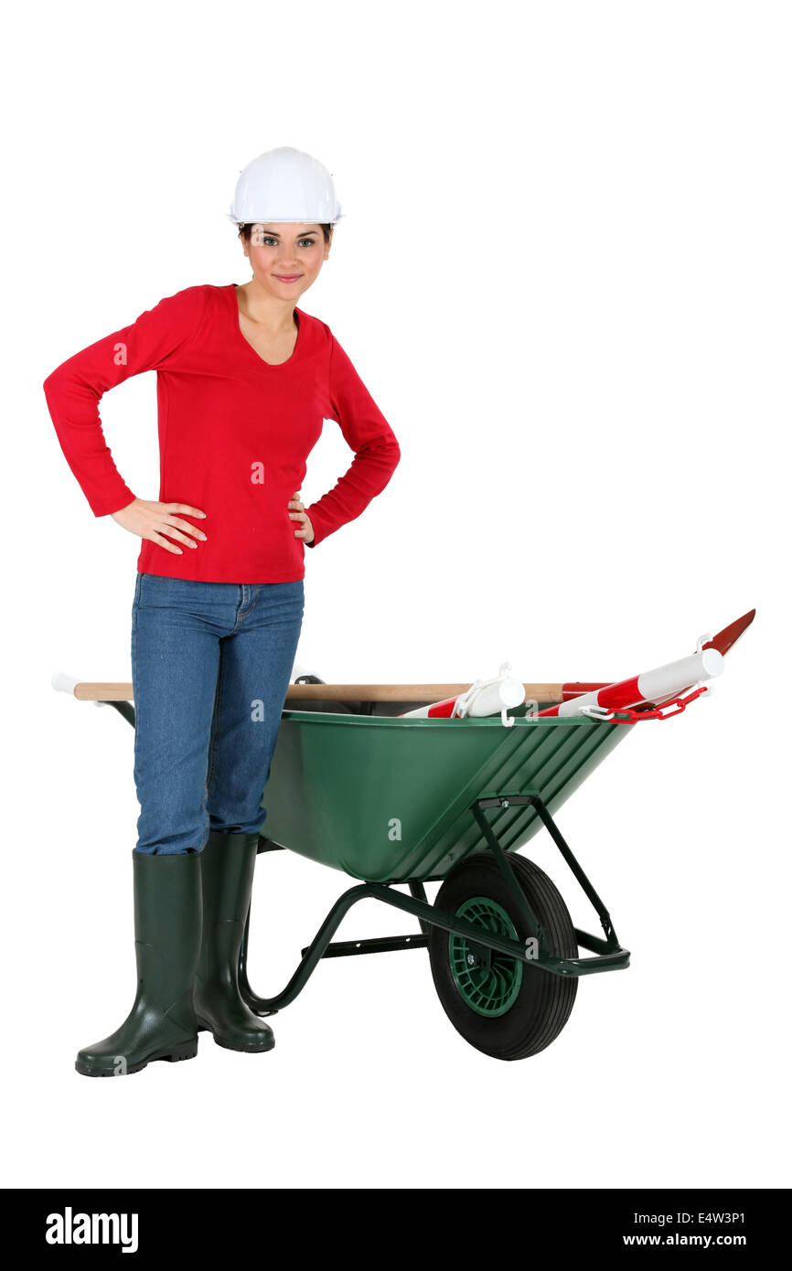 Construction worker with a wheelbarrow Stock Photo