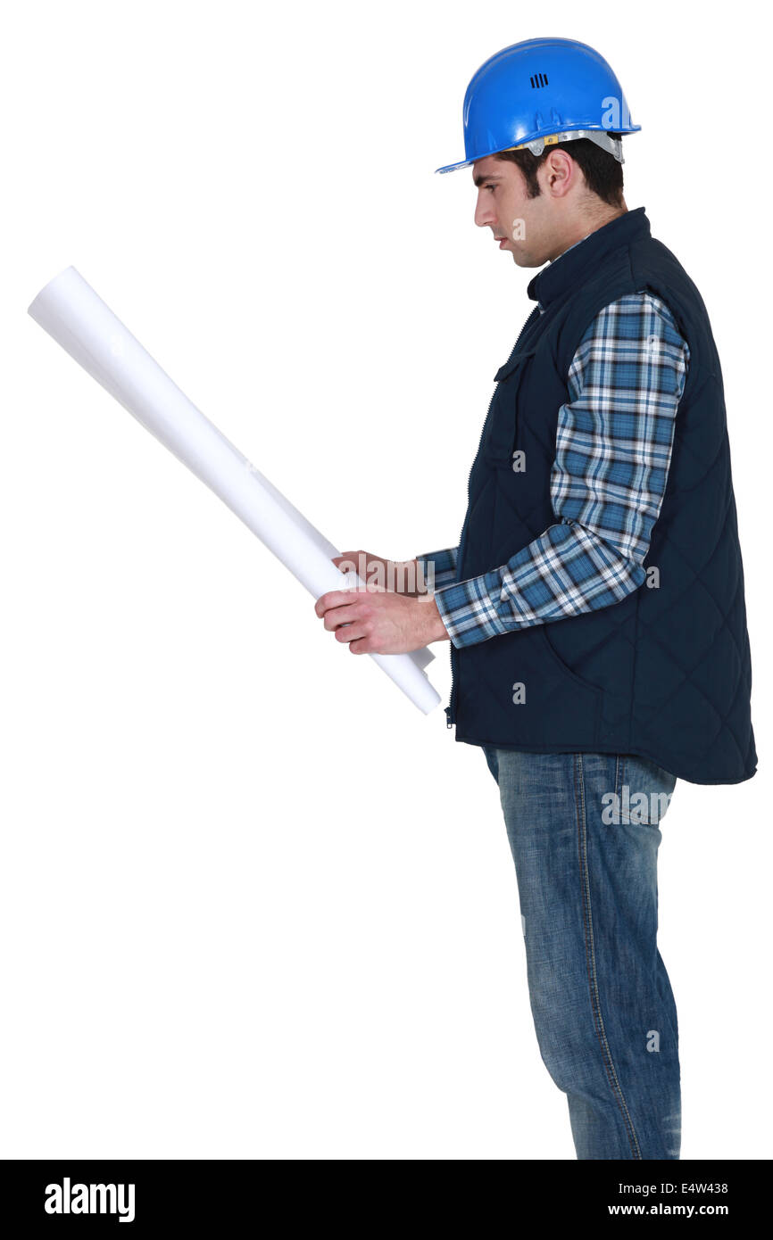 Builder looking at plans Stock Photo