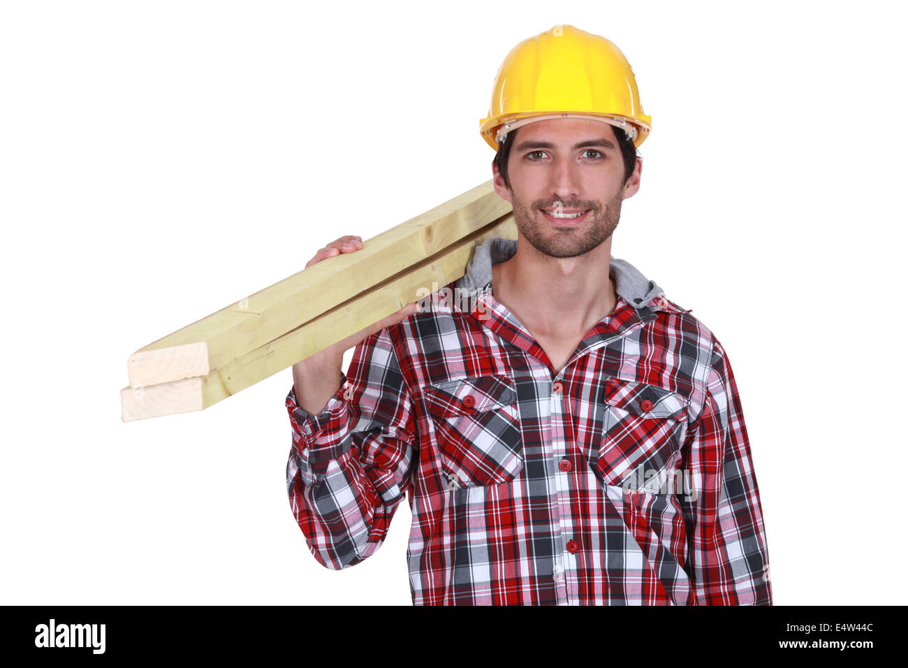 Tradesman carrying wooden planks Stock Photo