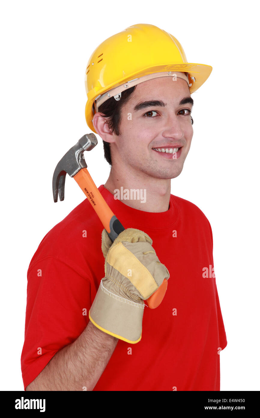 Young workman with a hammer Stock Photo Alamy