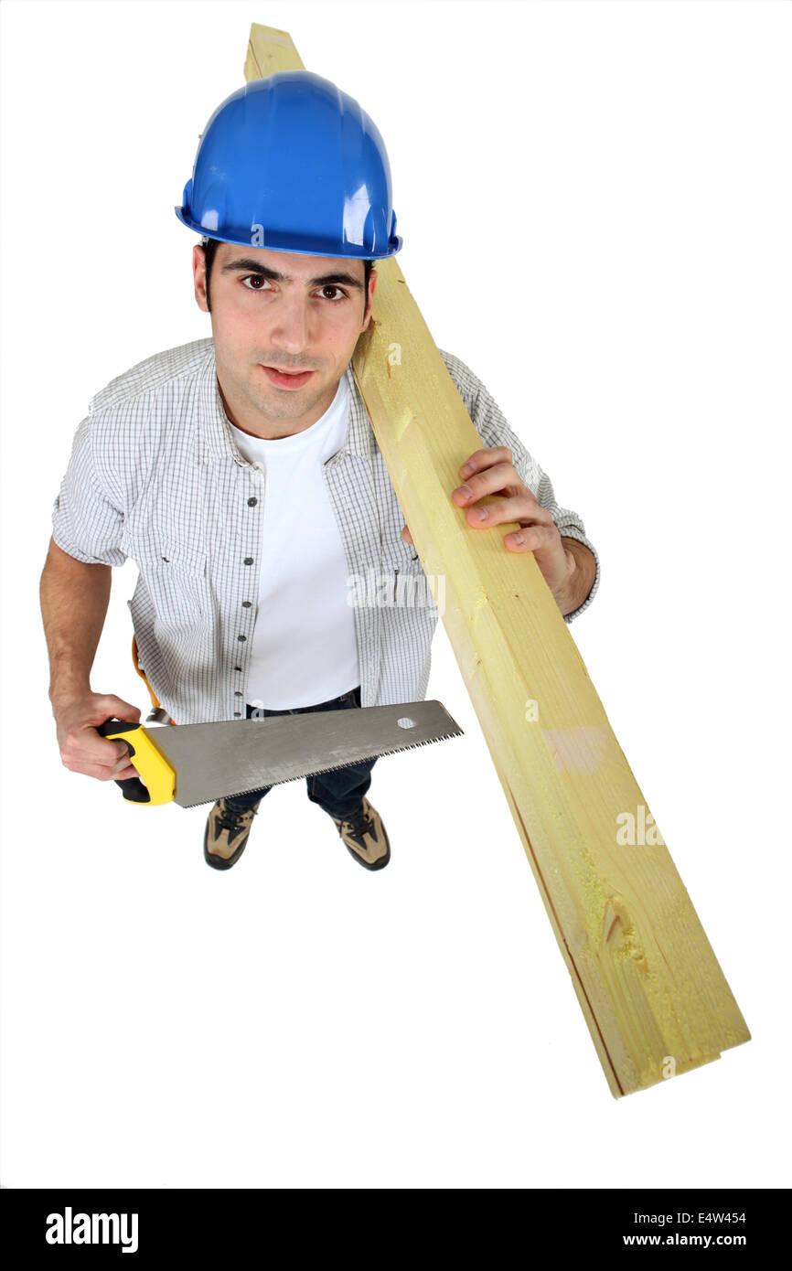 Tradesman holding planks of wood Stock Photo