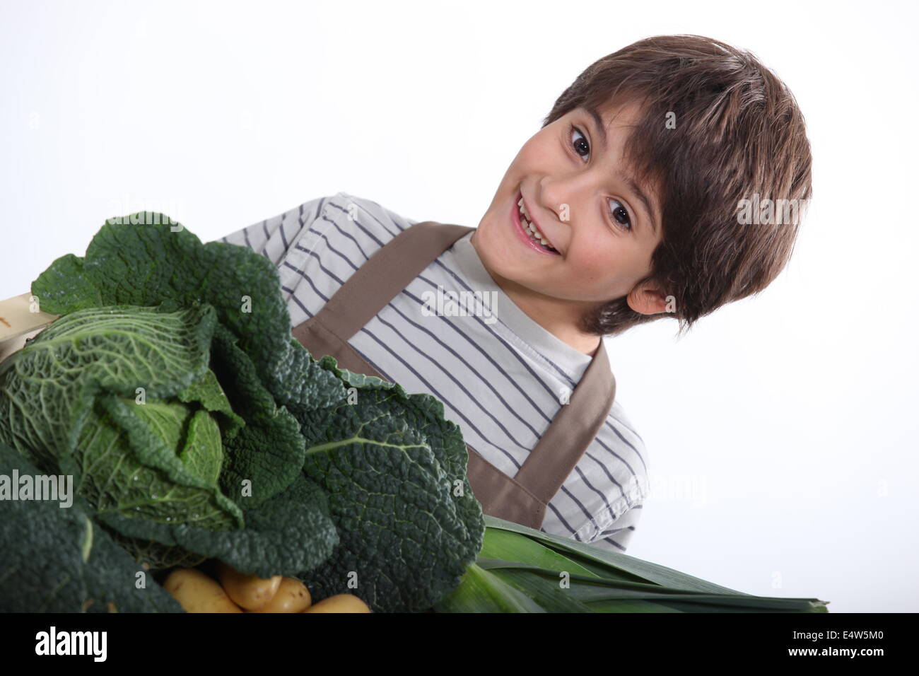Young boy with a selection of fresh produce Stock Photo Alamy