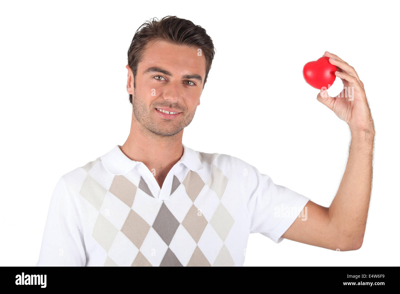 Holding a heart-shaped object Stock Photo