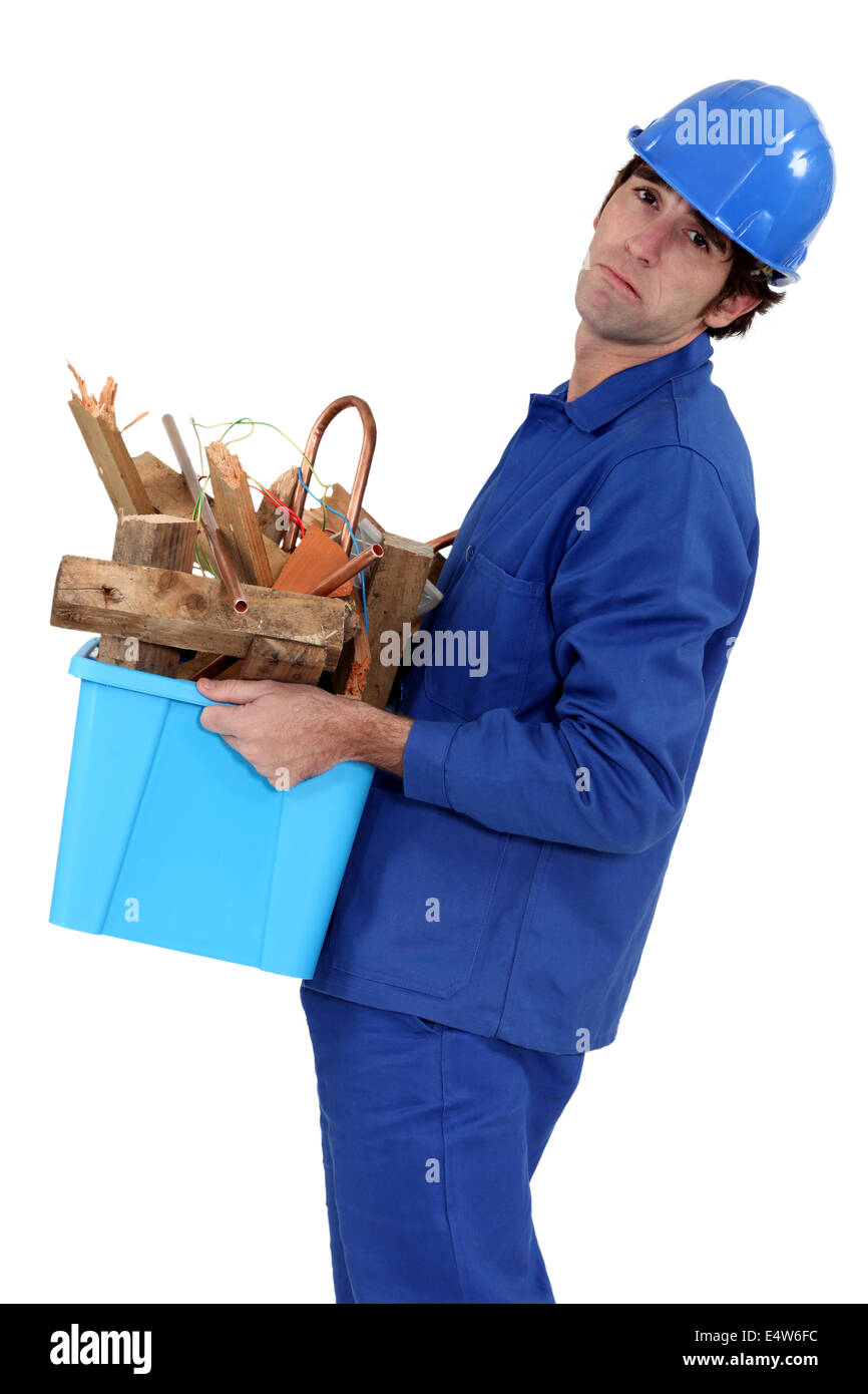 craftsman throwing away used materials Stock Photo