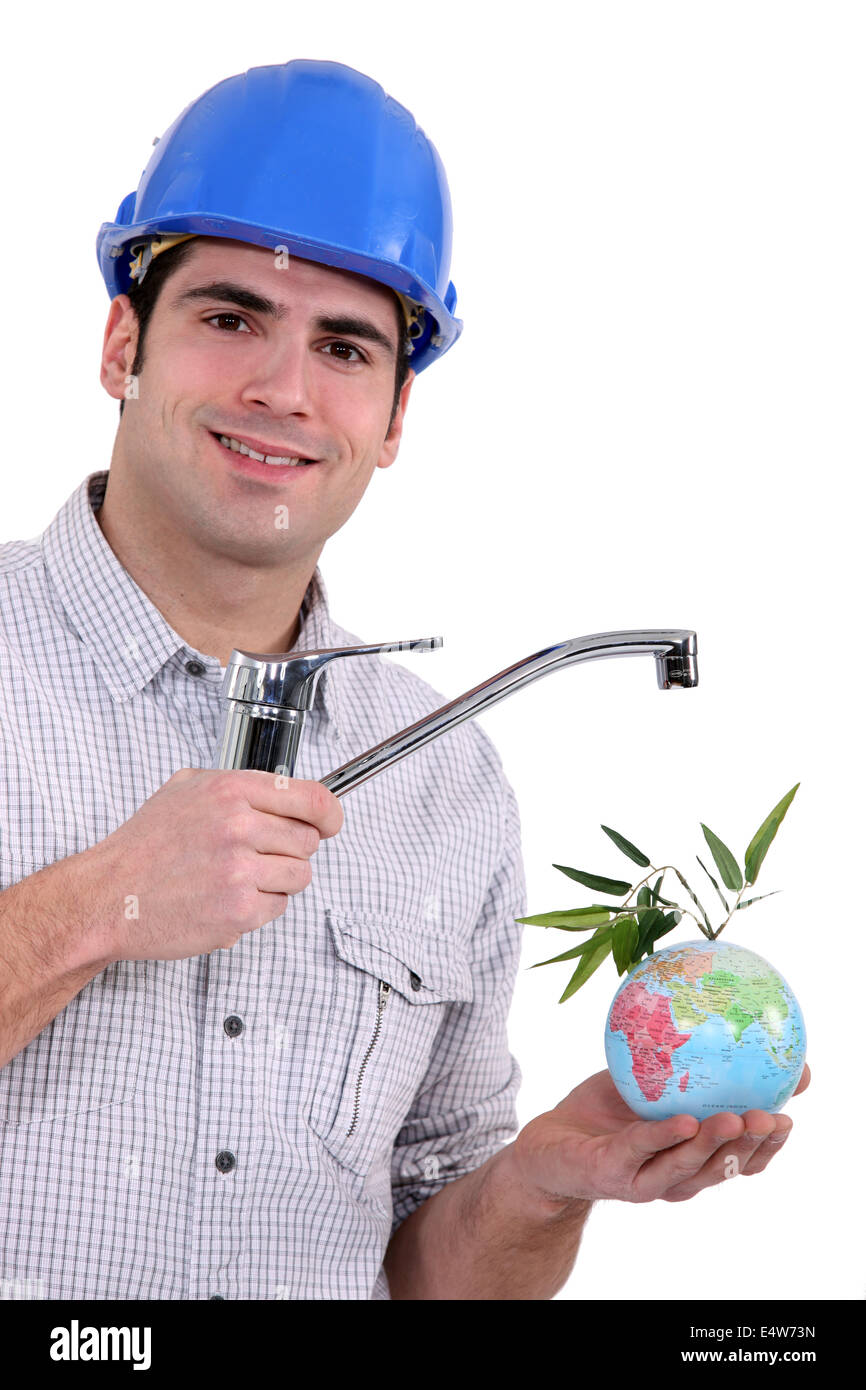 plumber with faucet and globe Stock Photo